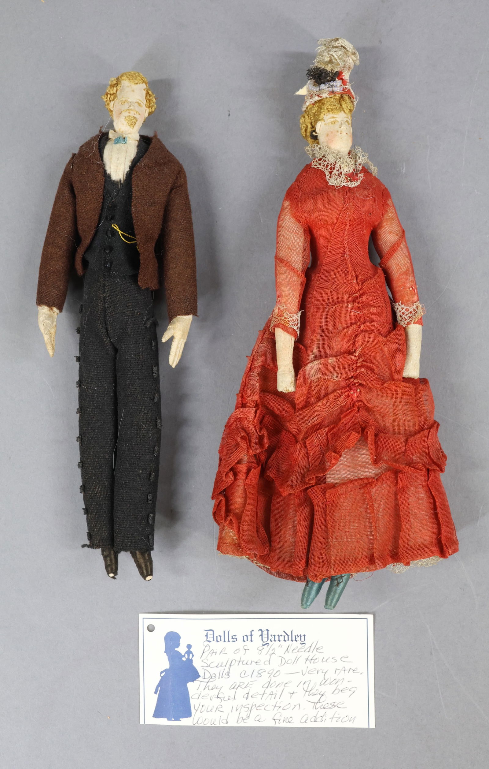 CLOTH DOLLS.: Pair of 8 1/2" ca. 1890 American needle sculpted doll house dolls. Hair has been made from cotton crochet thread and both have intricate styles. Embroidered features and ears. Dressed in detailed