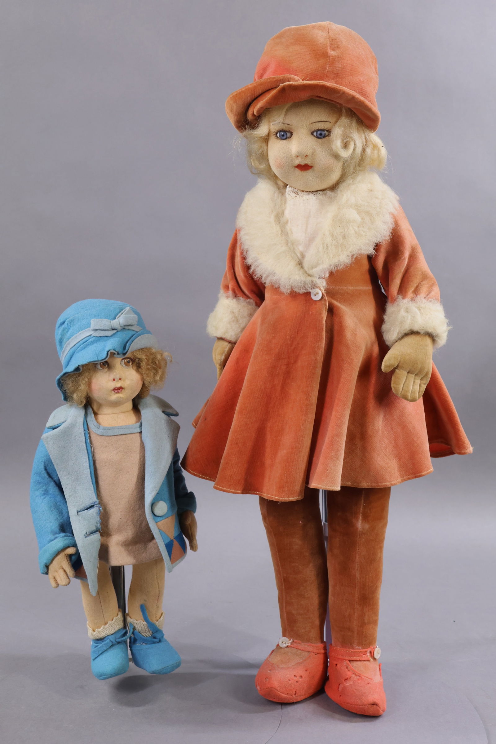 CLOTH DOLLS.: Pair of dolls. 12" 1930's LENCI doll with painted brown side glance eyes, curly honey blonde mohair wig. Dressed in all original felt clothing, cotton teddy, socks. Condition: age discoloration,