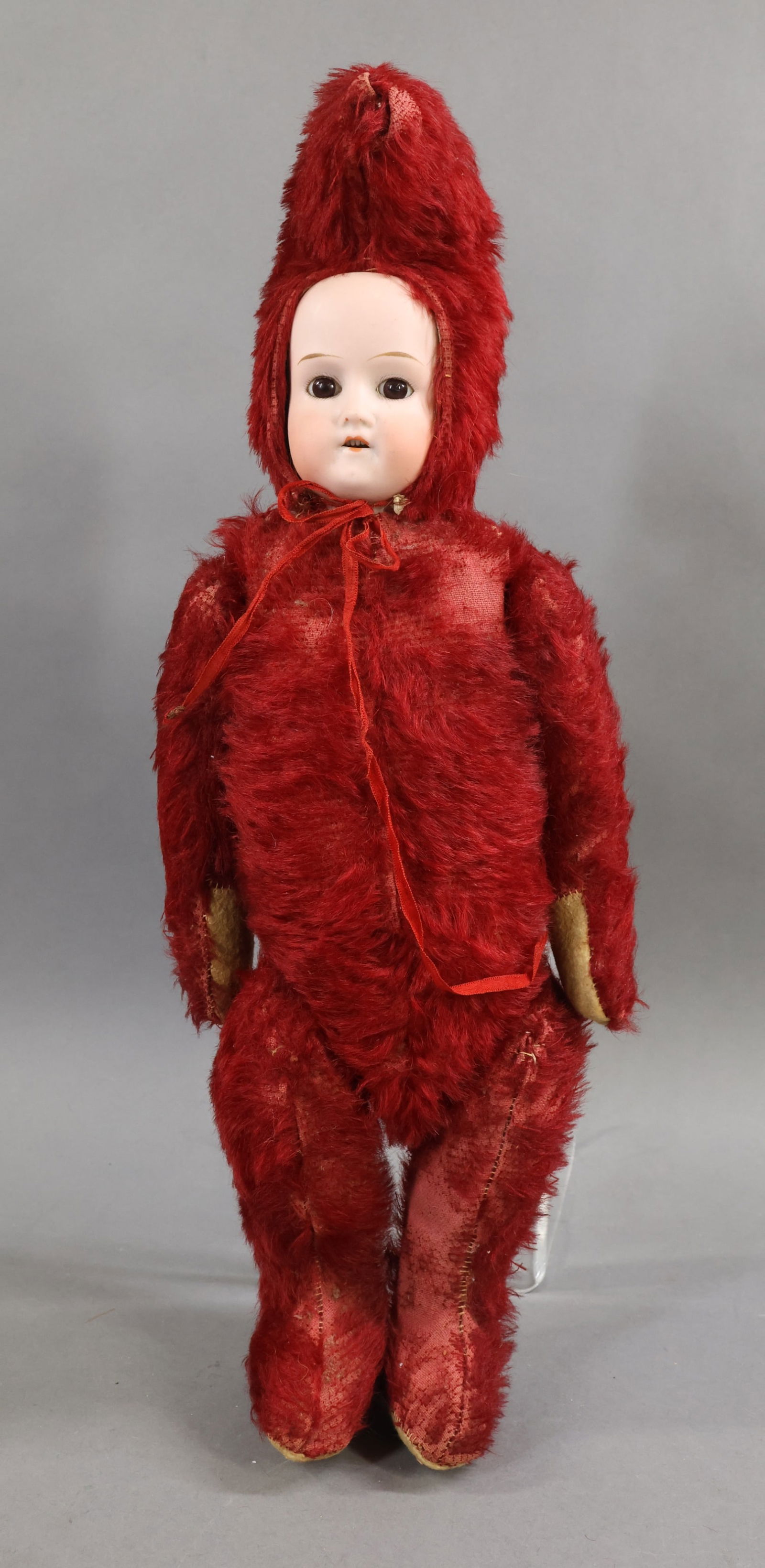 ANTIQUE NOVELTY BEAR.: 18" German "Teddy Dolly". German (Dressel) bisque shoulder head with stationary eyes, open mouth, brown mohair wig. Dark red mohair Bear body with felt pads. Jointed arms and legs. Separate mohair "ha