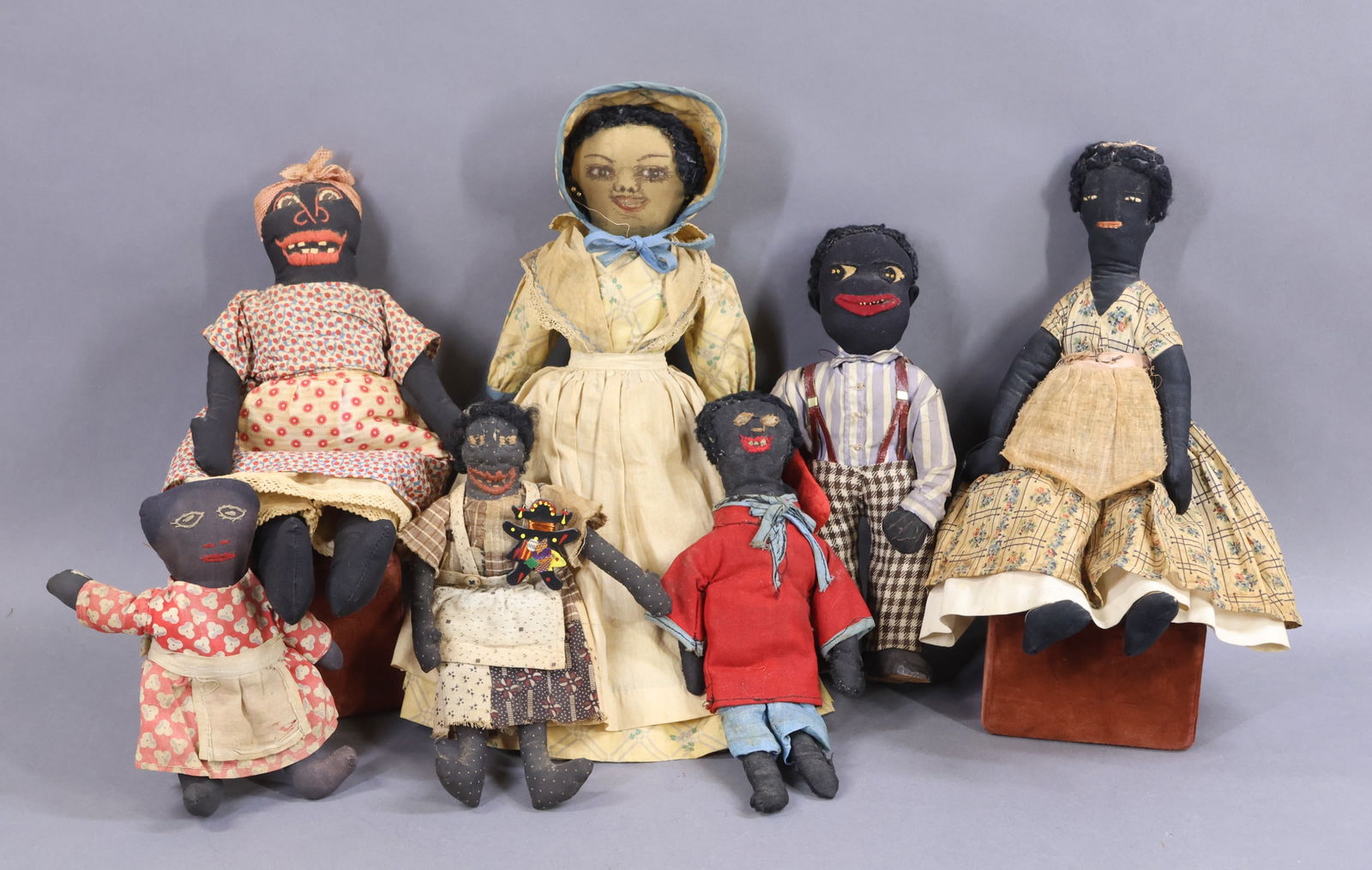 BLACK DOLLS.: LOT of handmade cloth rag dolls with embroidered and painted faces. 1930's Time period? All but (3) of the dolls have black wool yarn hair. Painted face (really pen/ink) -14" doll with very detailed