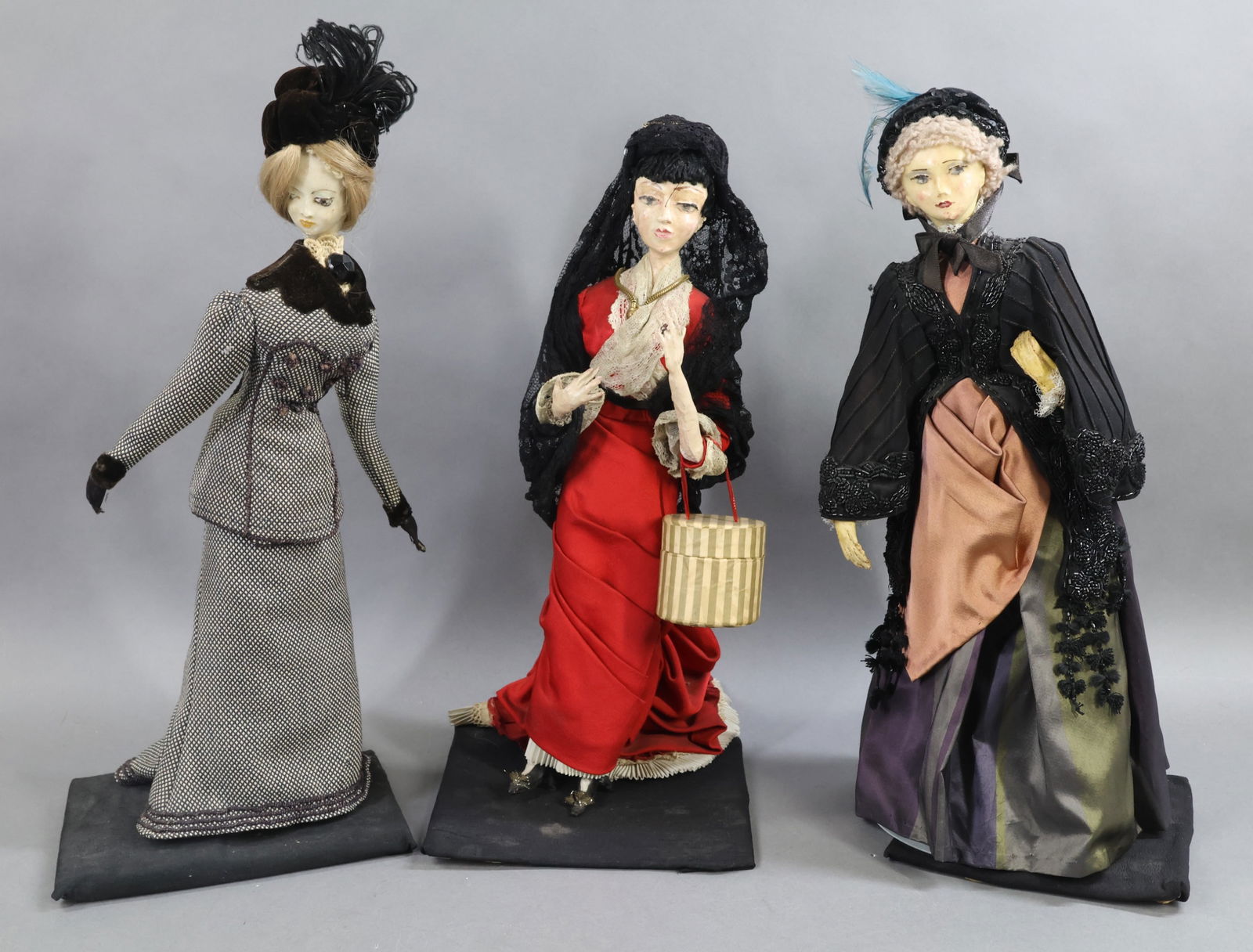 PAPIER MACHE/COMPOSITE DOLLS.: LOT of (3) antique Papier mache/composite shoulder head "Fashion" dolls signed on bottom by artist MELANIE. They are all 16" T and mounted on a base with description of each one. Heads are sculpted