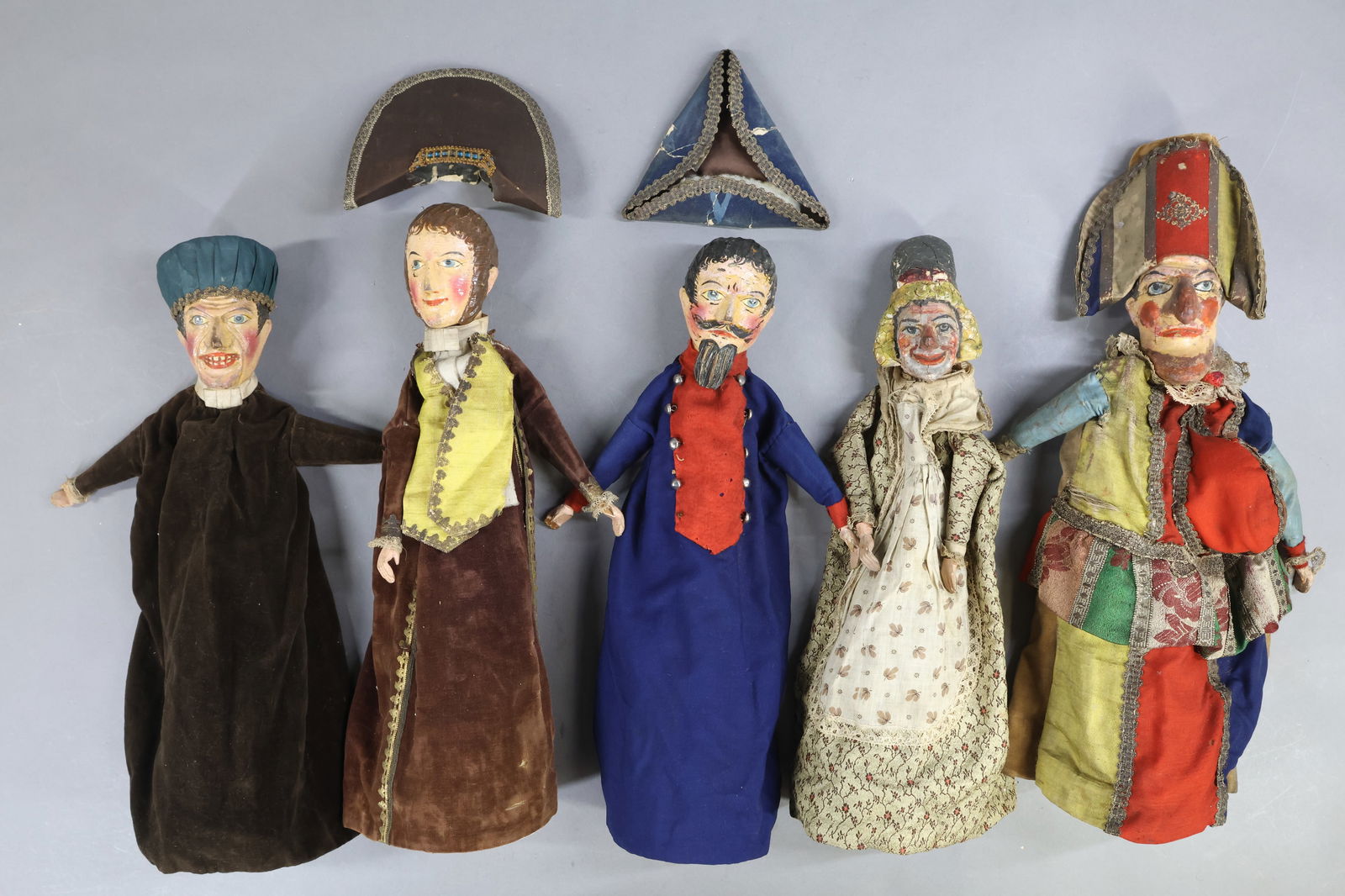 NOVELTY TOYS.: LOT of (5) antique "Punch & Judy" type puppets with carved wooden heads. They all have wooden hands, none have the wooden legs. All are mounted on styrofoam cones. They appear to be all original.