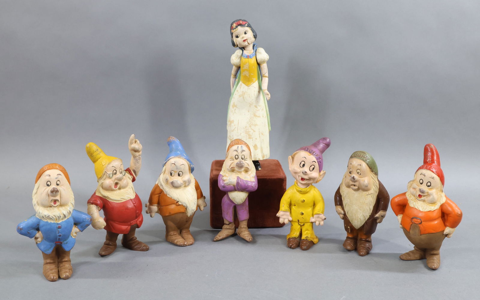 NOVELTY TOYS.: Set of 1937-1938 (c) Walt Disney Seven Dwarfs (5"-6") and 8" Snow White. Seiberling Latex, Akron, OH USA. Condition: age loss, discoloration. This lot is being sold AS IS.