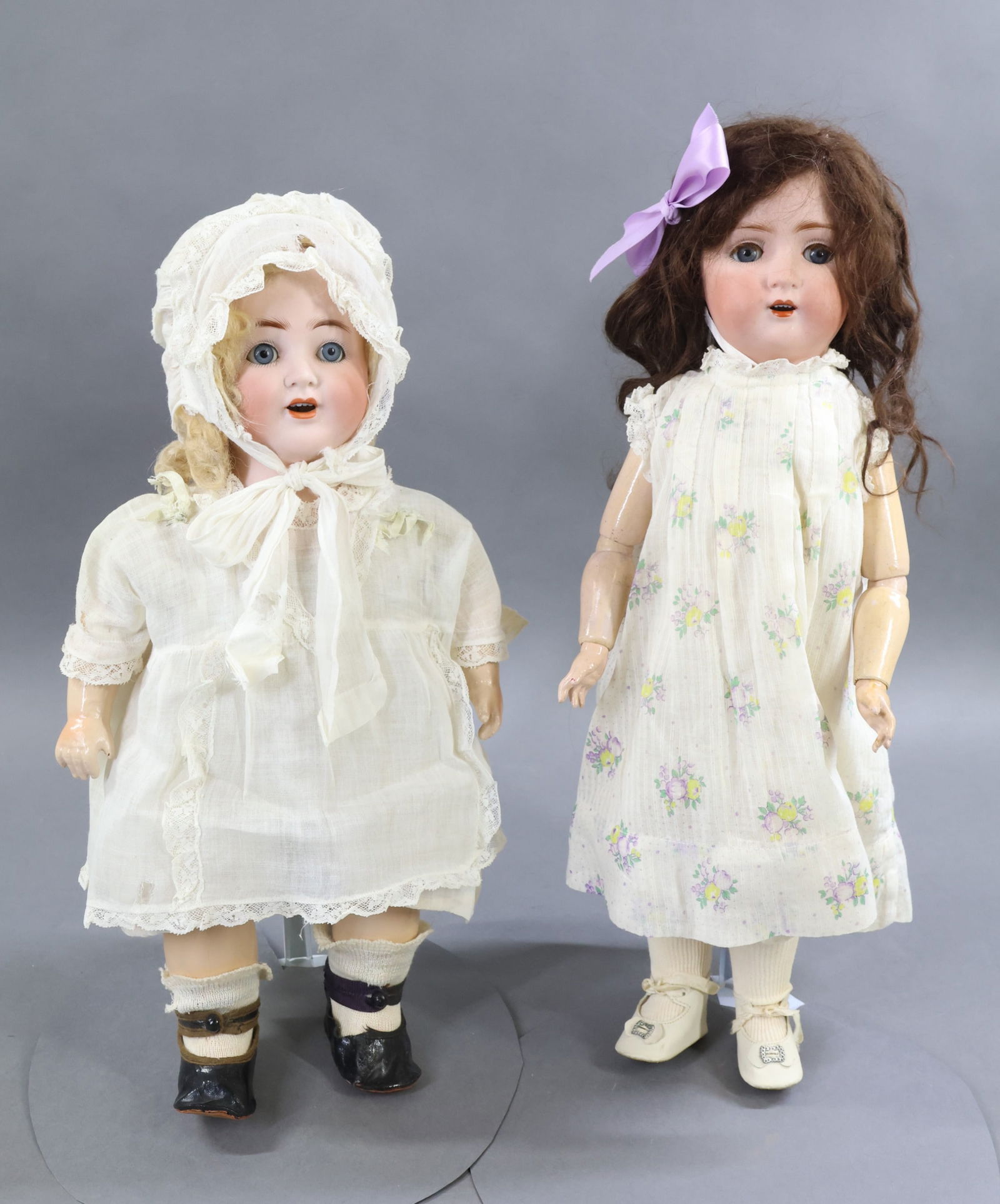 GERMAN BISQUE DOLLS.: Pair of dolls. Both dolls have blue sleep eyes, open mouths. They are dressed in vintage/antique clothing, underwear and are wearing antique shoes. Doll 1) 15" 38 K & K 45 Character toddler with a bis