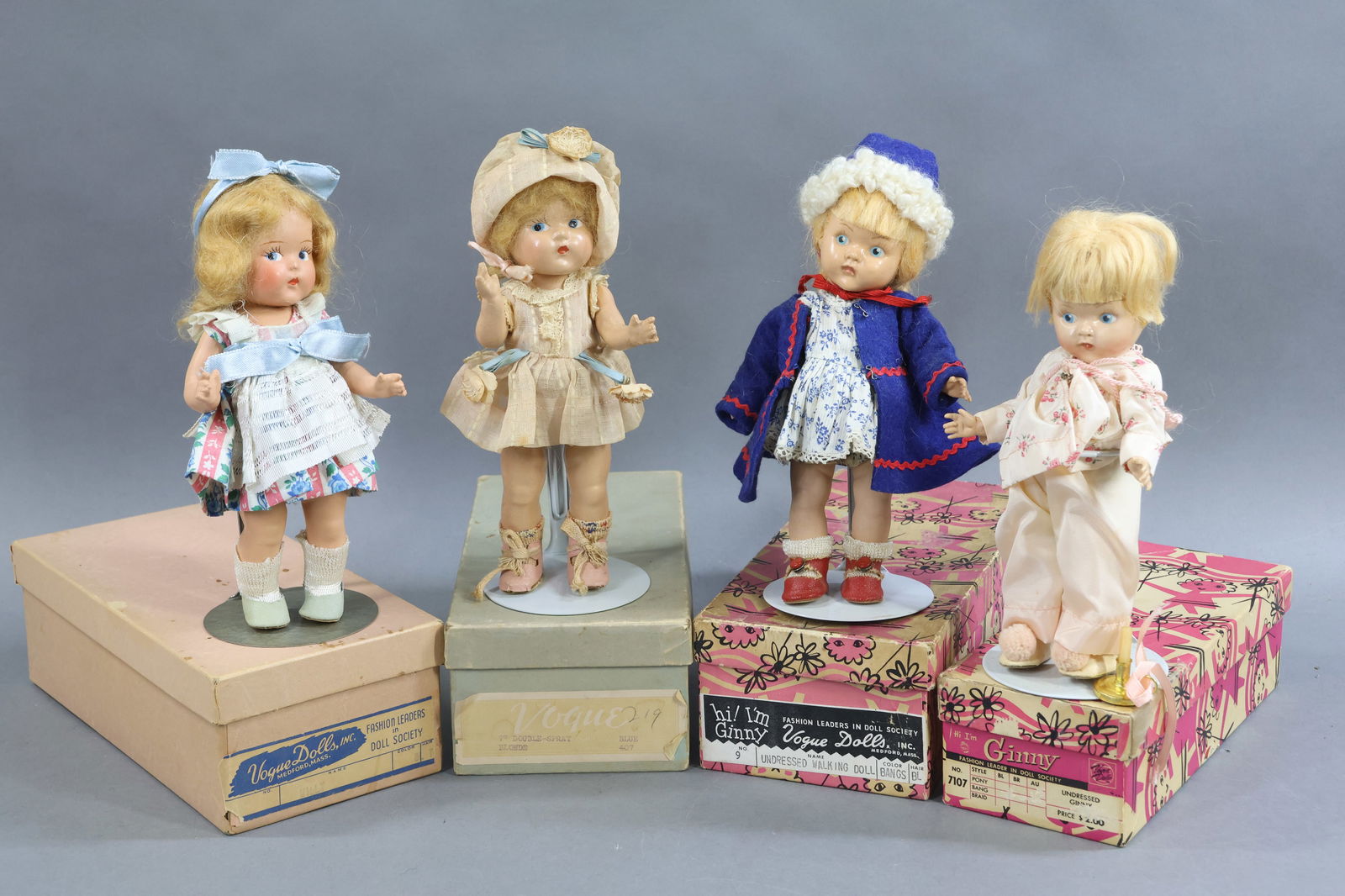 1930's-1940's DOLLS.: LOT of (4) 8" VOGUE dolls. (2) 1937-1948 All composition "Toddles" dolls with painted blue side glance eyes. Both have blonde mohair wigs. They are each dressed in unmarked but original clothing. Oilc