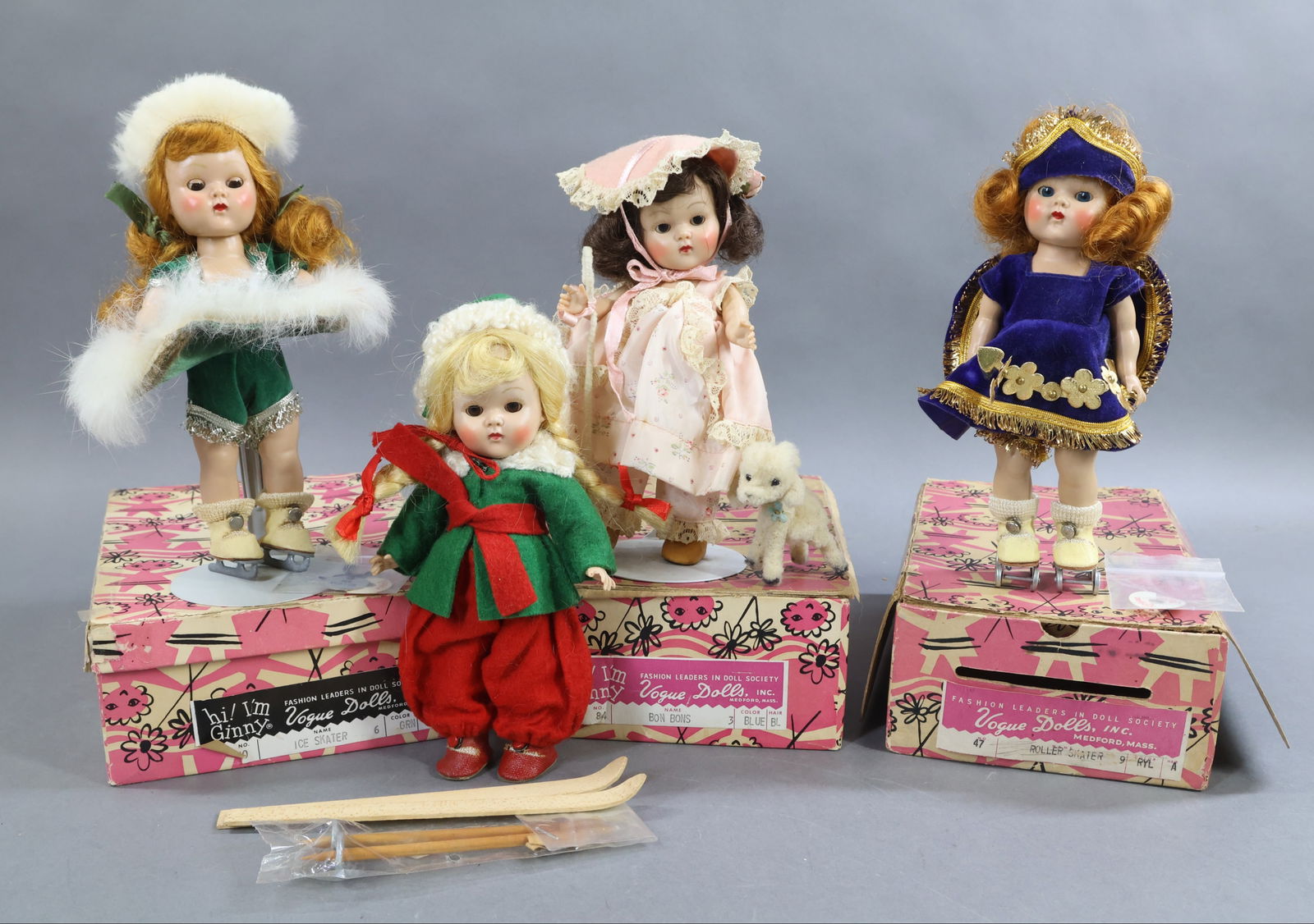 1950's-1960's DOLLS.: LOT of (4) 8" VOGUE "Ginny" dolls. (3) Of these dolls are 1950-1953 and are SL PL strung dolls. The "Ice Skater" in green is a 1954 PL SLW doll. She has her silver hang tag. Both "Little Bo Peep" (wit