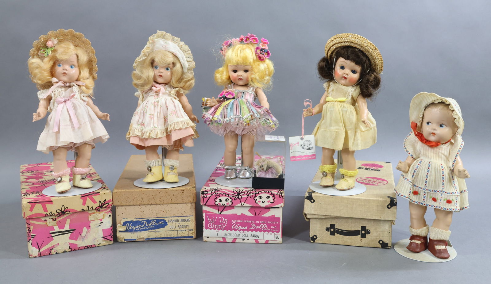 1930's-1960's DOLLS.: LOT of (5) 8" VOGUE Dolls. (1) 1937-1948 Composition "Toddles" doll with painted side glance blue eyes, brown hair. Marked VOGUE on back of head. Dressed in unmarked (but appears) original outfit, oil