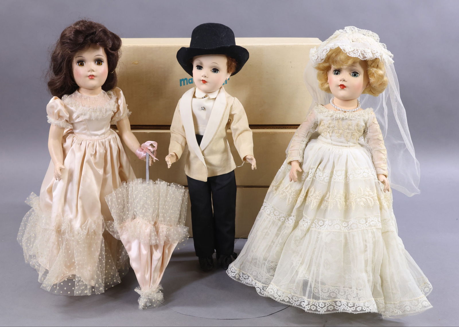 1950's-1960's DOLLS.: LOT of (3) MARY HOYER hard plastic 14" dolls, each with OB. "Bride" and "Groom" both have blue sleep eyes. Bride - has a blonde wig (which has been nicely restyled). Tagged Bridal gown. Petticoat, pan