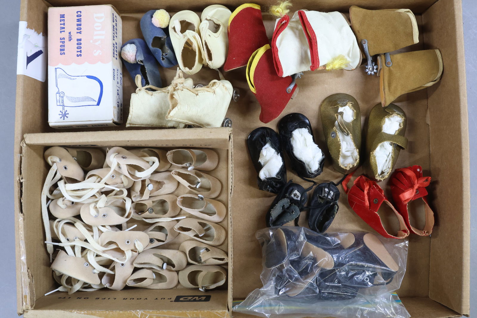 1940's-1970's DOLL ACCESSORIES.: LOT of shoes. (10) Prs. beige suede center snap/side snap shoes, 1 3/4". (5) Prs. beige suede oxford shoes, 1 3/4". (5) Prs. (newer) black patent shoes (for 14" dolls). This may be OSS. Also - (11)