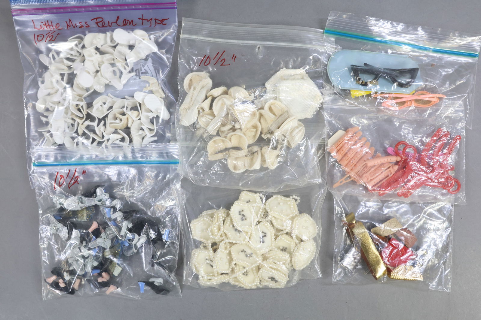 1960's-1970's DOLL ACCESSORIES.: LOT. Shoes - (27) Prs. white vinyl high heel shoes for 10 1 1/2" Fashion dolls (Little Miss Revlon type). (13) Prs. high heel shoes with elastic for 10 1/2" Fashion dolls (Jill, Jan, Little Miss