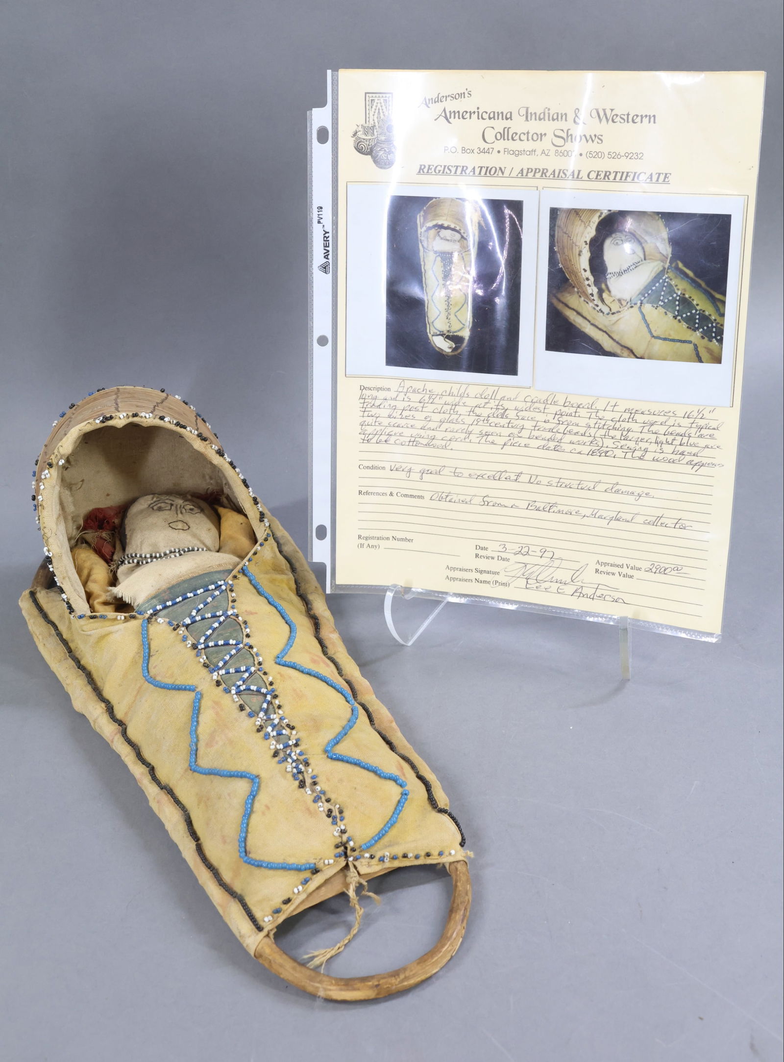 NATIVE AMERICAN DOLLS.: All original APACHE Child's Doll and Cradleboard. 16 1/2" L x 6 1/2" W x 5 1/2" T (at highest point). This item comes with a registration & appraisal certificate dated March 22, 1997. Description is