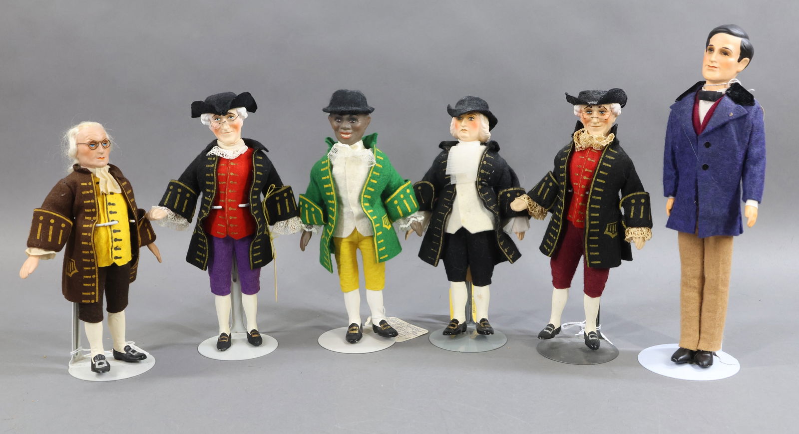 CONTEMPORARY/UFDC DOLLS.: LOT of (6) dolls by artist Xanthos Kontis Contradis. (3) Of them with yellow hang tags are UFDC Convention dolls. They range from 9"-11 1/2". "Pa Pitt" was made for the 4th convention, held in 1953