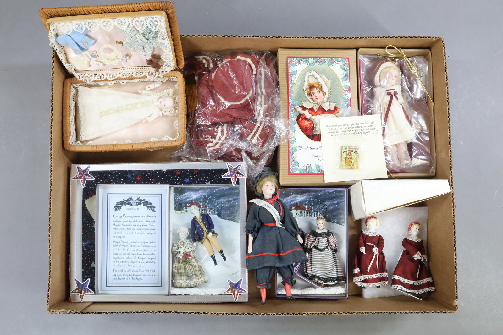 CONTEMPORARY/UFDC DOLLS.: LOT of UFDC/Region 13/ luncheon souvenir dolls made by different artists. Rosemarie Snyder - Miss Cape May County. George and Martha Washington, 12/2011. Baby in wicker case with wardrobe. Pat Boldt