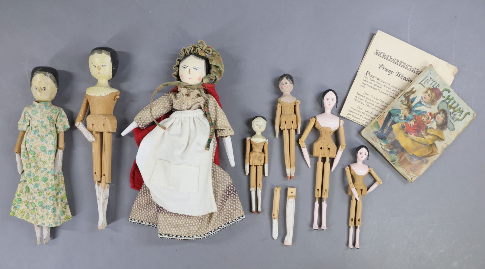 WOODEN DOLLS.: LOT of Peg Wooden/type dolls. These vary in age with antique/vintage and contemporary dolls. (5) Dolls with painted hair - 6 1/4", 7", 11 1/2", 12". (2) Are dressed. Extra limbs. Condition: age loss,