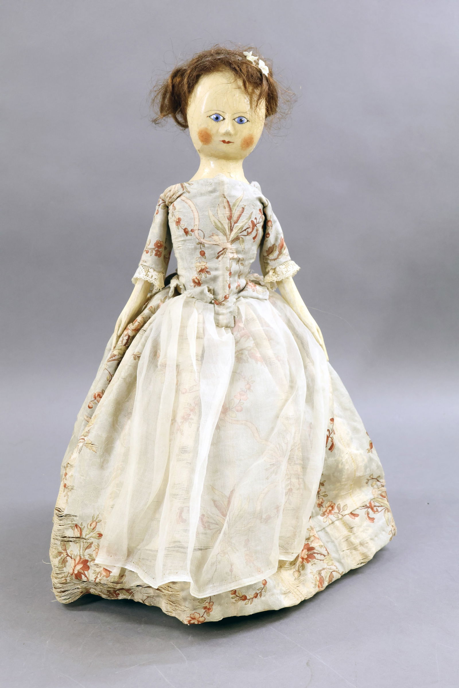 WOODEN DOLLS.: 16" English (Georgian Period?) doll with round head, gesso covering, inset blue glass eyes, somewhat dotted eyelashes and eyebrows. Human hair wig. Jointed wooden body, cloth upper arms, wooden lower