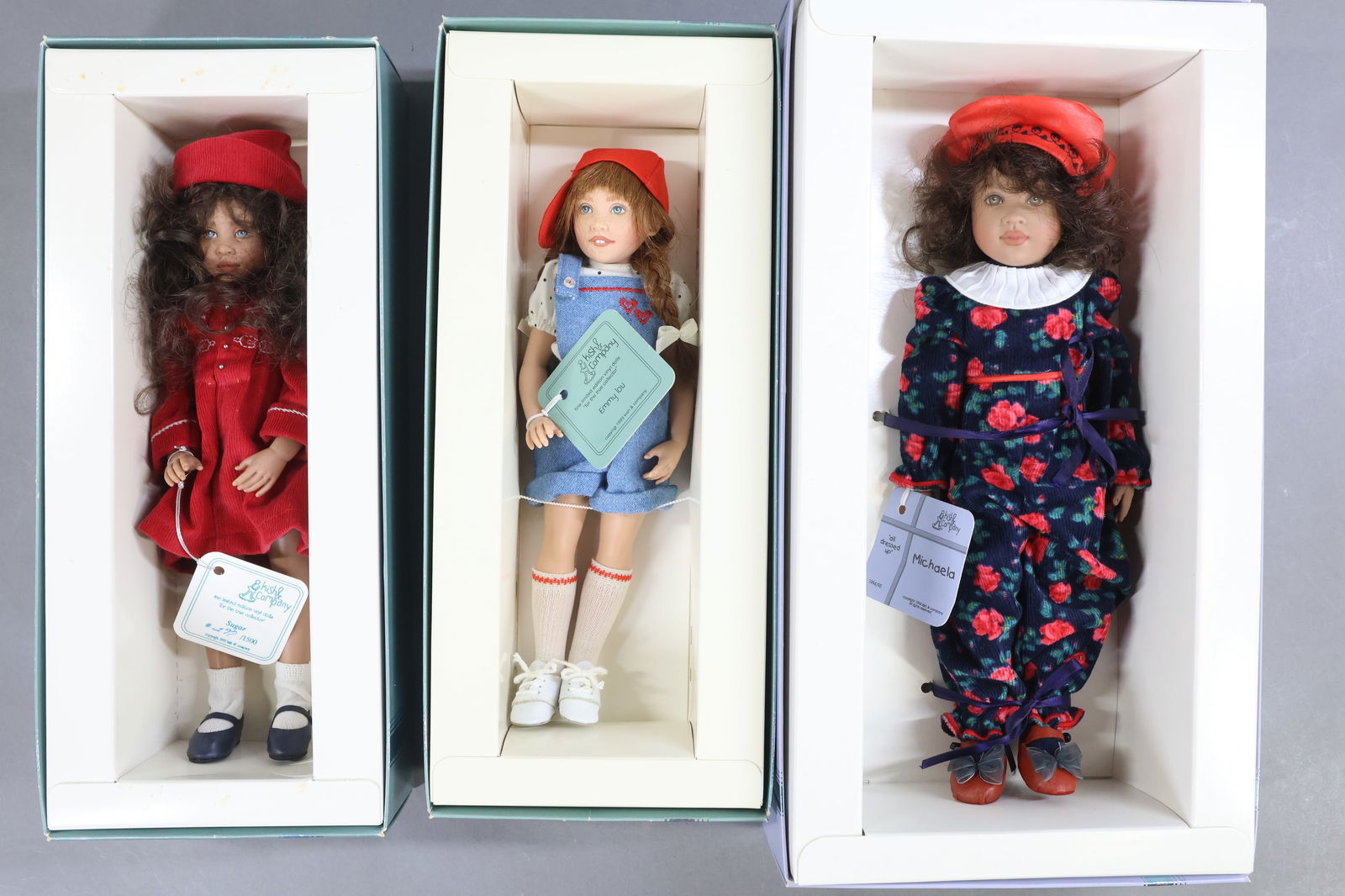 CONTEMPORARY ARTIST DOLLS.: LOT of (3) MIB NRFB dolls by artist Helen Kish. 11 1/2" 1994/1995 "Michaela" - All Dressed Up. COA. 10" 1993 "Sugar" Children of Yesteryear. 297/1500, hangtag. 10" 1993 "Emmy Lou". This lot is being