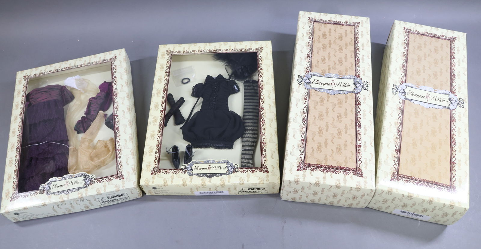 CONTEMPORARY ARTIST DOLLS.: LOT of ELLOWYNE WILDE by Wilde Imagination. (2) Dolls. MIB "Pale Memories". MIB Unidentified Blonde doll. (2) Outfits - MIB "Oh My Goth". "Ennui At Tea" in OB. Outfit has been out of the box and is