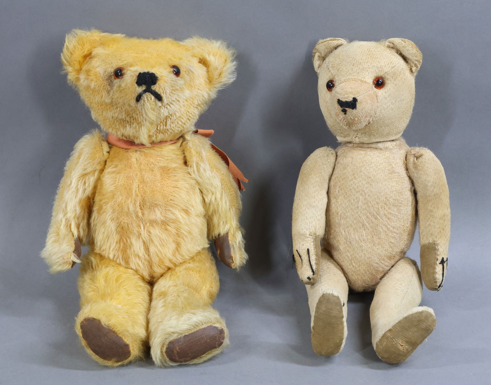 VINTAGE ANIMALS.: Pair of unmarked mohair Bears. Both bears have brown glass eyes and are fully jointed with swivel heads. 14" Long gold mohair, painted oilcloth? pads. Condition: pads were repainted years ago. Age