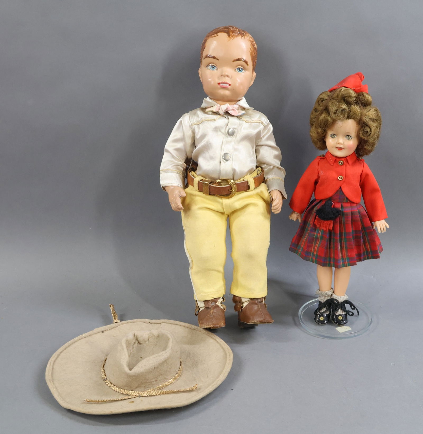 1940's-1960's DOLLS.: Pair of dolls. 16" HP "Gene Autry" . Back of doll reads (raised letters) TERRI LEE PAT. PENDING. All original clothing, shirt is tagged Gene Autry. Condition: leather belt has been repaired. Heel