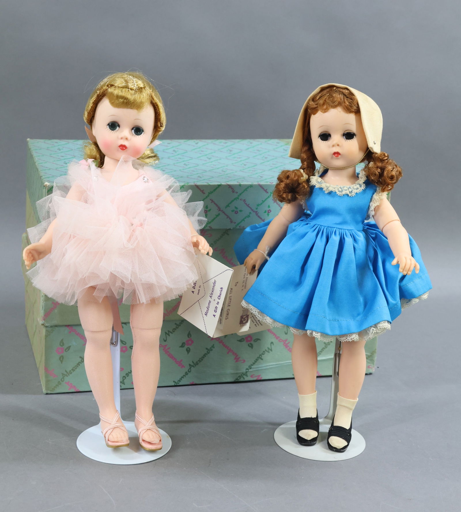 1940's-1960's DOLLS.: Pair of MINT MADAME ALEXANDER 1956-1958 "Lissy" dolls in OB. Both dolls are all original, are dressed in tagged clothing and have their hang tags. Blonde Lissy Ballerina. Redhead with braids.