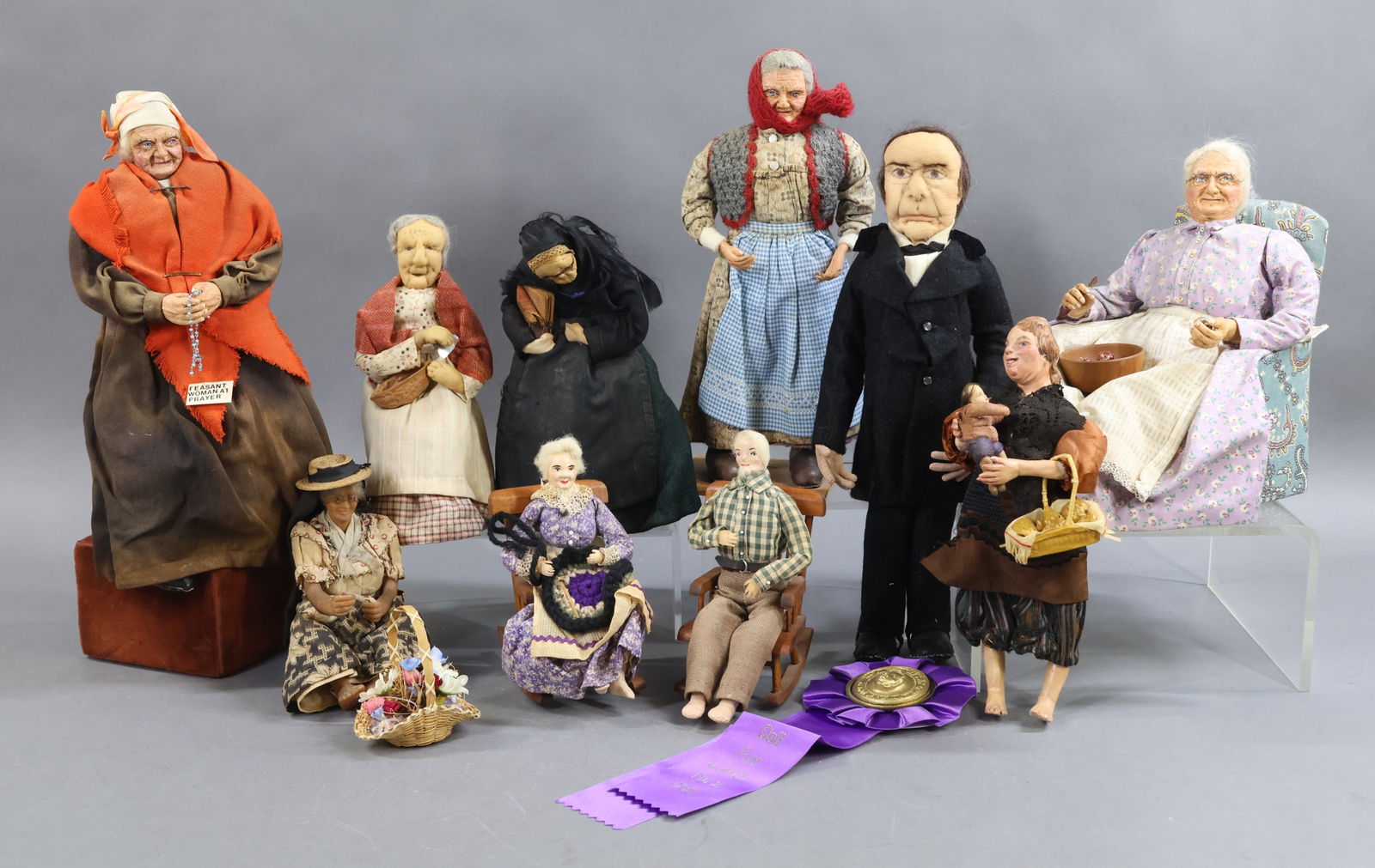 ARTIST DOLLS.: LOT of misc. Folk Art dolls. (3) were made by artist Huldah Olson, only (1) has a tag. (3) Dolls with needle sculpted faces by artist Gwen Flather. (1) Is marked. Ozark couple in rocking chairs. She