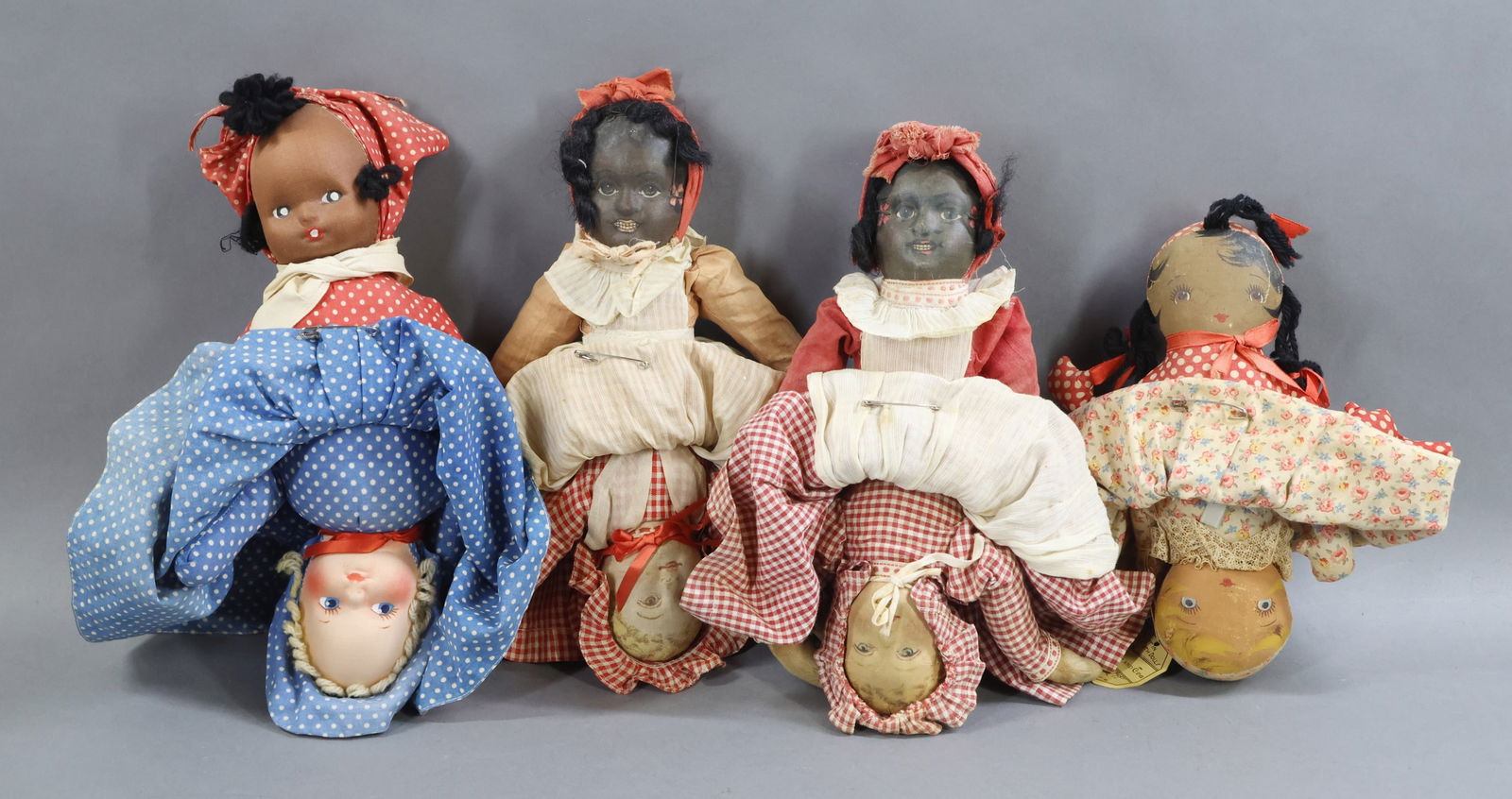 BLACK DOLLS.: LOT of (4) cloth Topsy-Turvy dolls. Pair of 12" BRUCKNER Black/White dolls. 10" Tagged GEORGENE Novelty Black/White "Topsy and Eva" Art in Cloth Dolls. 12" Unmarked mask face Black/White dolls.