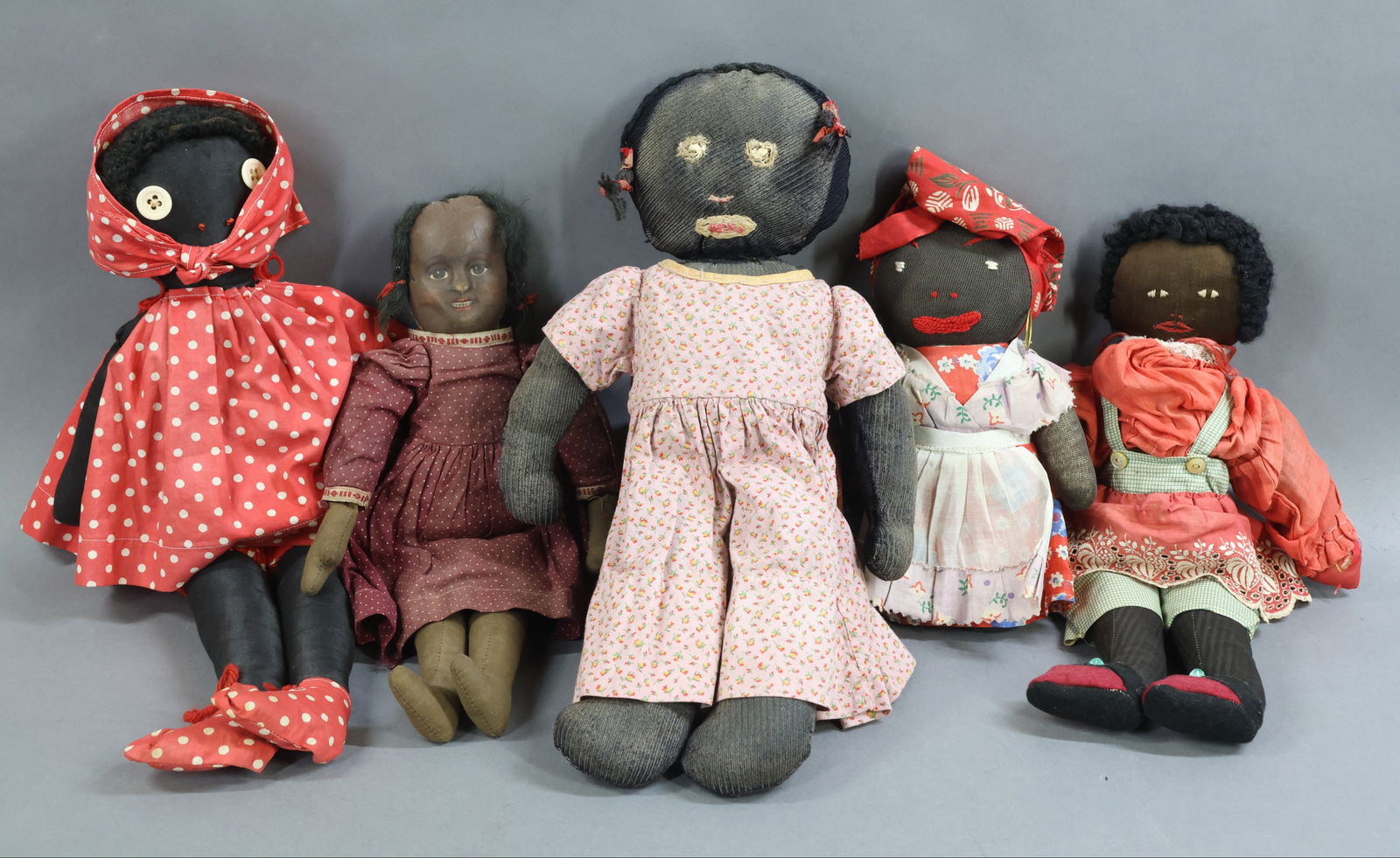 BLACK DOLLS.: LOT of (5) cloth dolls. 13" BRUCKNER. The following dolls appear to have been handmade in the 1930's. 17" Doll made from cotton sateen, embroidered features, button eyes. Lambswool wig. 15" Doll made