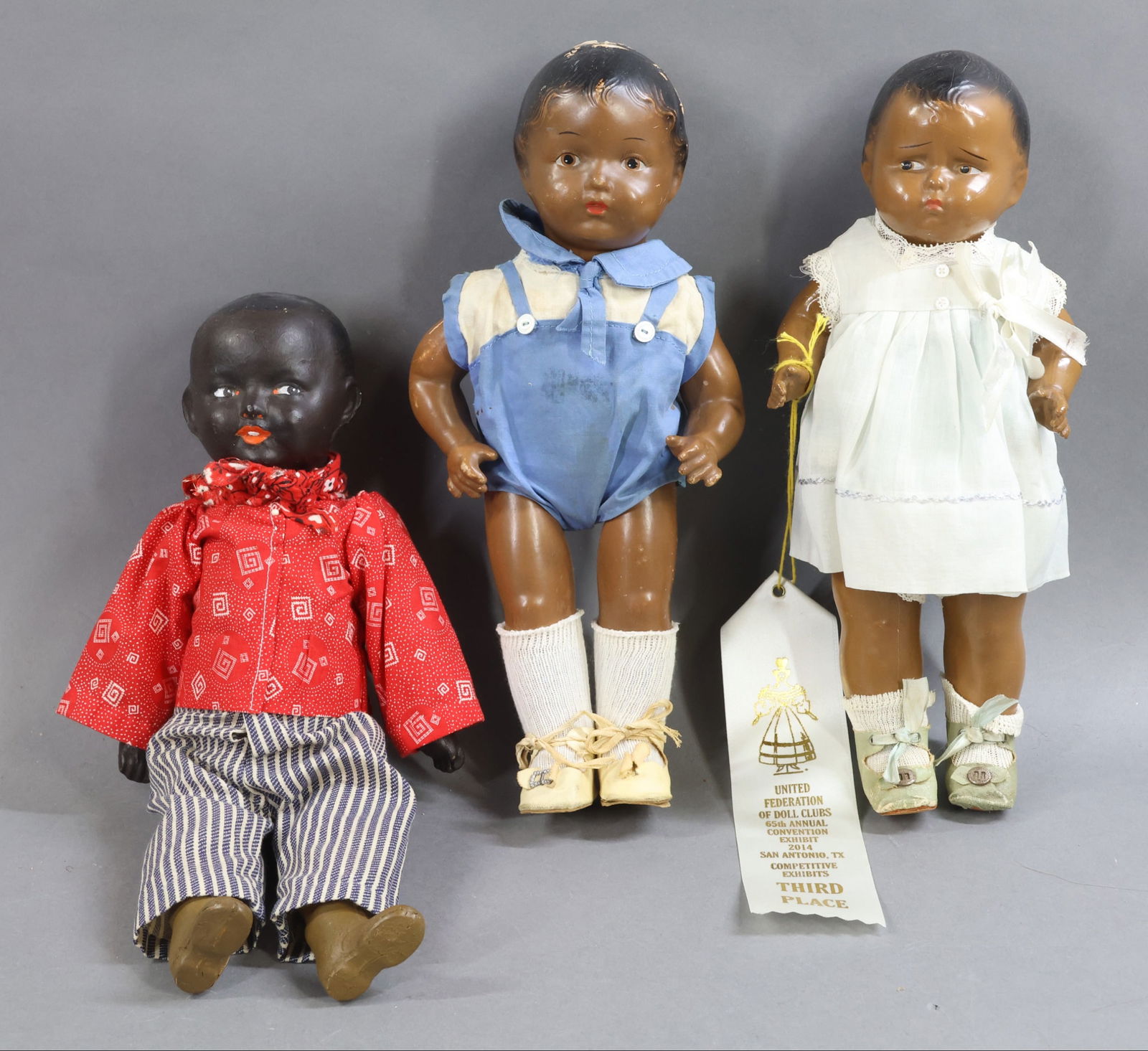 BLACK DOLLS.: LOT of (3) composition dolls. All of the dolls have painted hair and features. 12" 1925-1932 EFFANBEE "Grumpykins" doll with composition shoulder head, arms and legs. Cloth body. Vintage clothing, pal