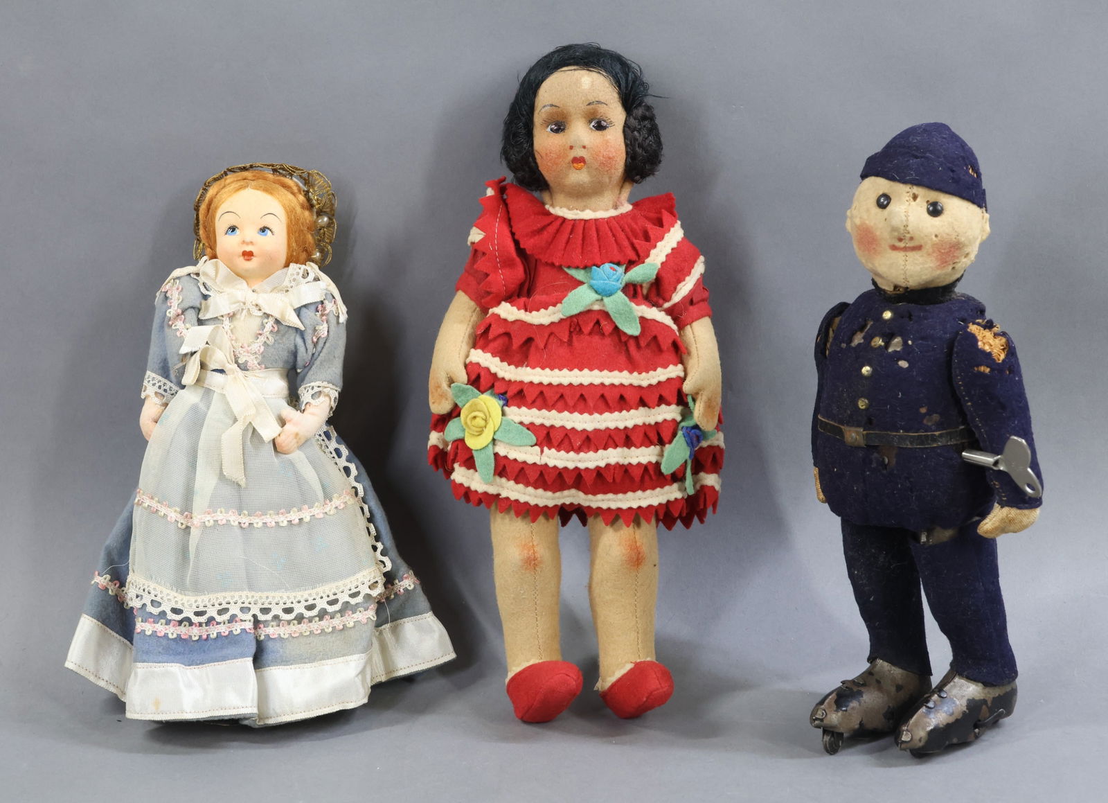 VINTAGE STEIFF TOY DOLL/CLOTH DOLLS.: LOT. 10" STEIFF "Skating Policeman" doll toy. Key wound. Felt head with center part seam. Felt uniform over metal frame. Metal "skates". When wound, skates move back and forth. Condition: moth