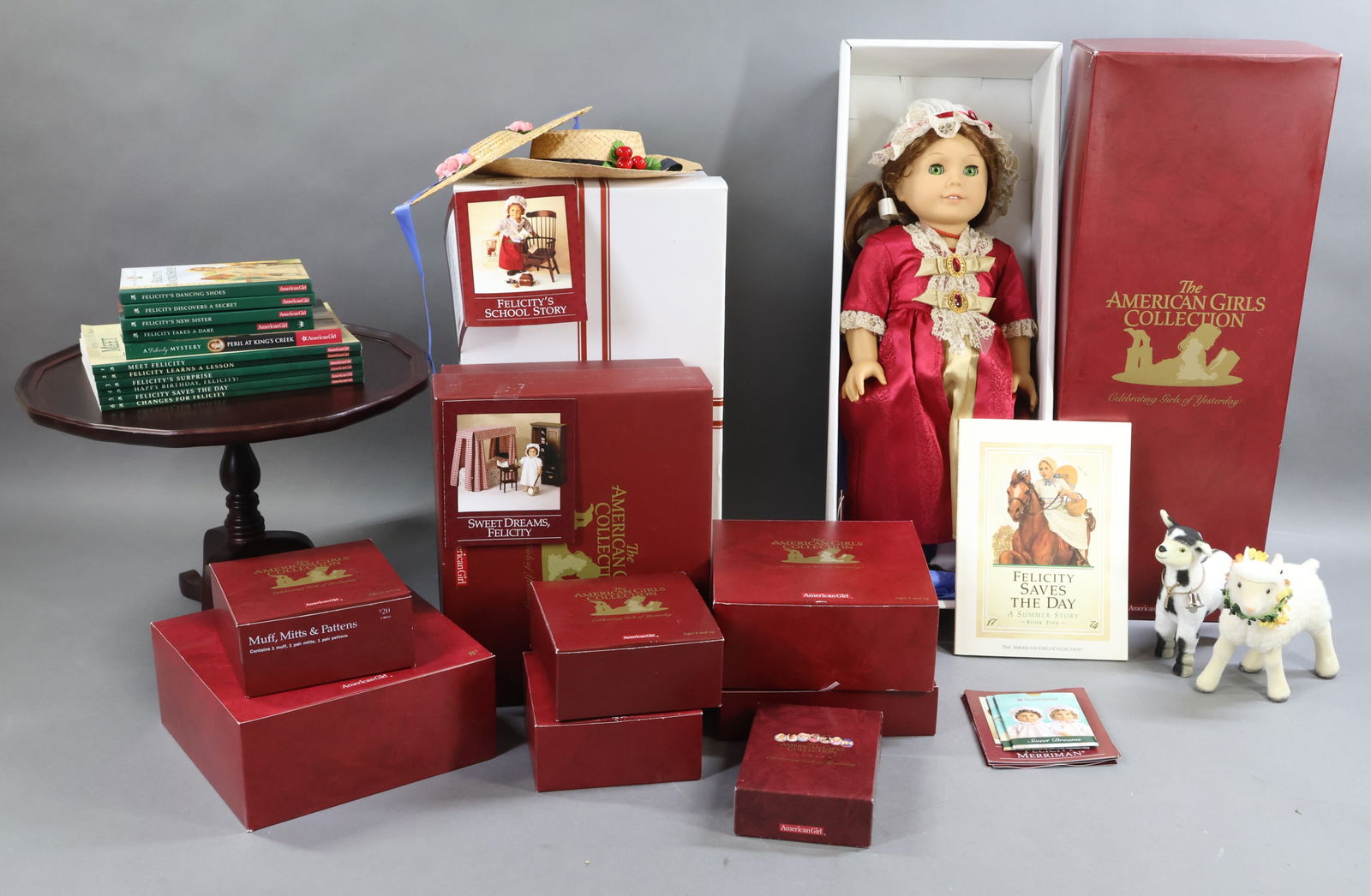 AMERICAN GIRLS.: LOT of FELICITY. Doll in OB w/book. Comes with Tilt-Top Table. Windsor Writing Chair. Dressing Table. Guitar. Framed picture. Books 1, 2, 3, 4, 5, 6. (4) Short Stories Books. (1) Mystery Book. Large l