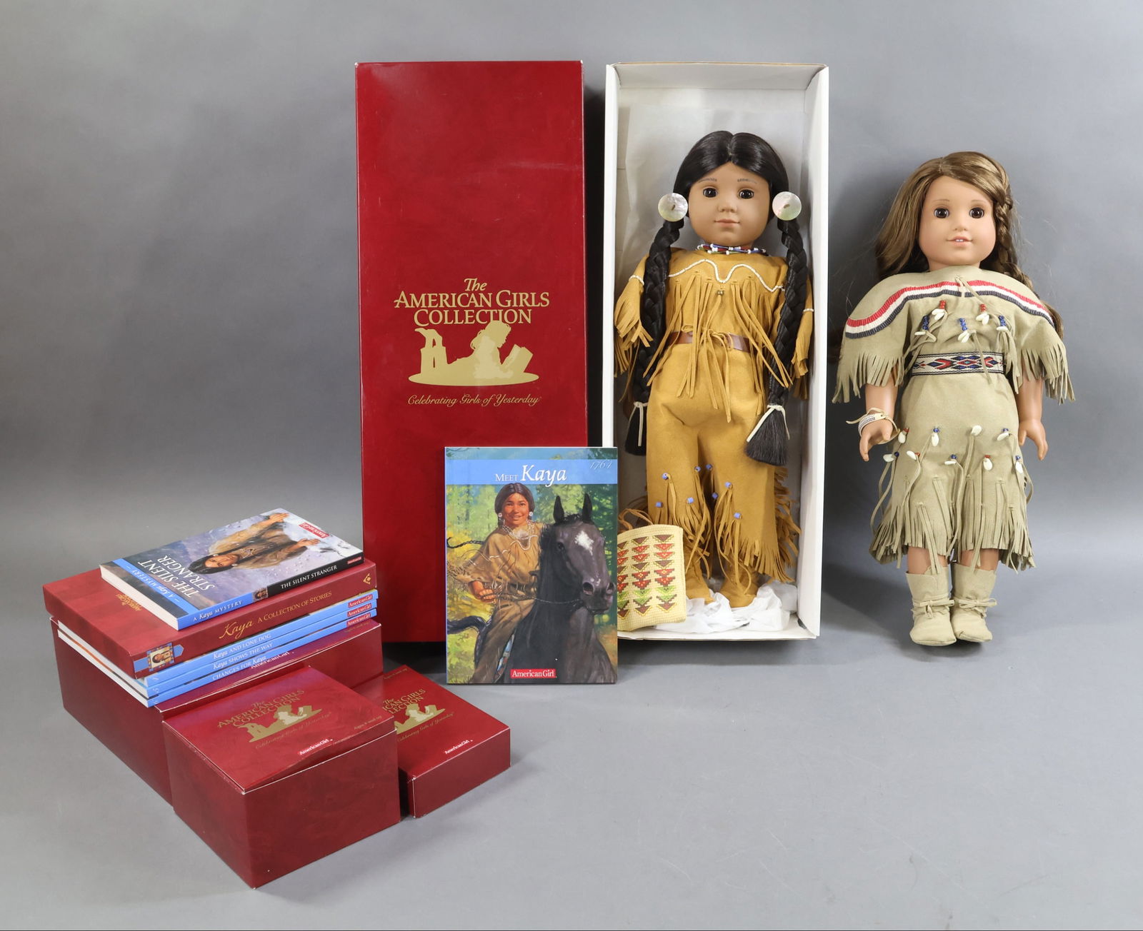 AMERICAN GIRLS.: LOT of KAYA. Doll in OB w/book. Additional unknown doll in KAYA clothing. Hat & Parfleche. Winter Outfit. Accessories. (1) Mystery Book. (3) Books in boxed set. (3) Books w/o case. This lot is being