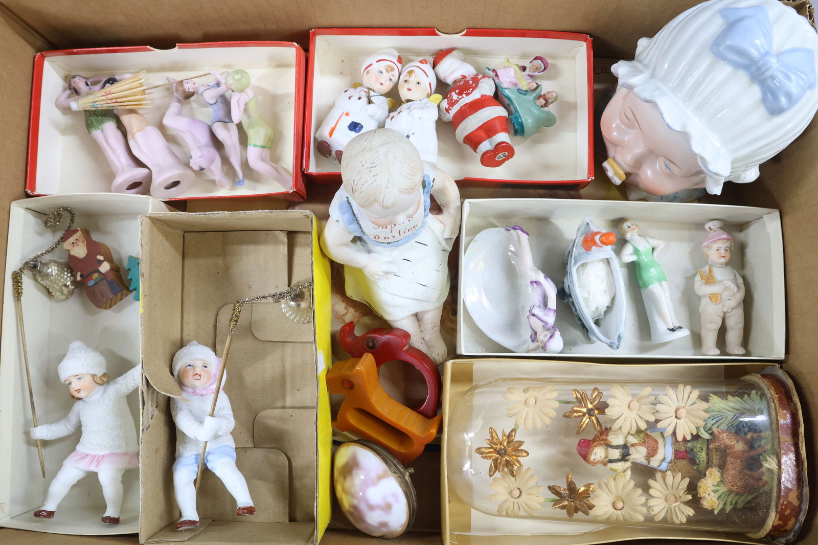 HOLIDAY/NOVELTIES.: LOT. Holiday - Pair of German 4 1/2" all bisque figures, boy and girl, covered with "snow". They are each holding a rod with a silver glass Christmas bell. (Damage on (1) bell.) German bisque Santa no