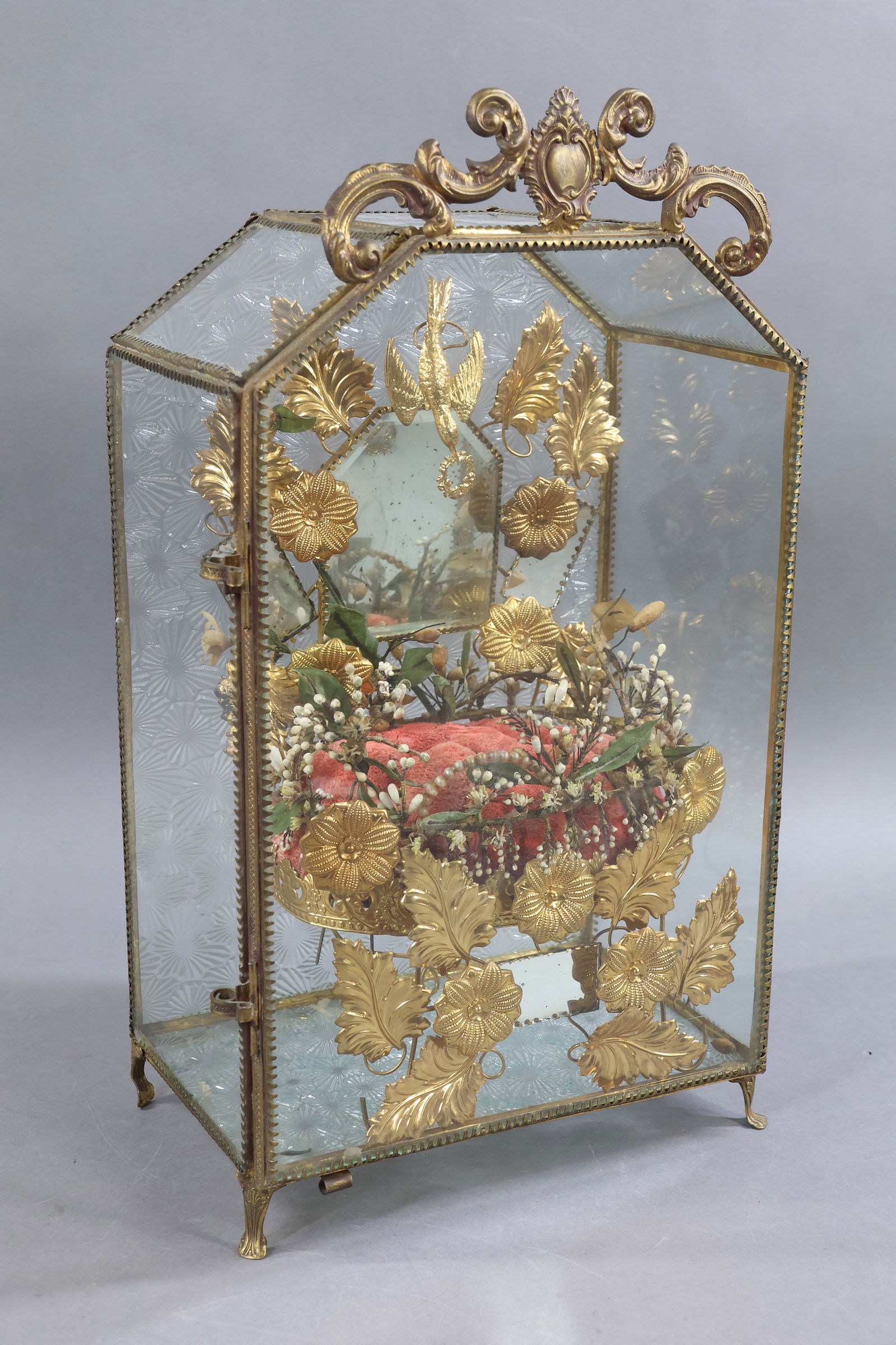 HOLIDAY/NOVELTIES.: French 19th c. "Globe de Marice" Marriage Case. 14 1/2" T x 9" W x 6" D. This was used to display the wedding flowers. Embossed back and floor, heavily decorated red velvet tufted seat. Metal and