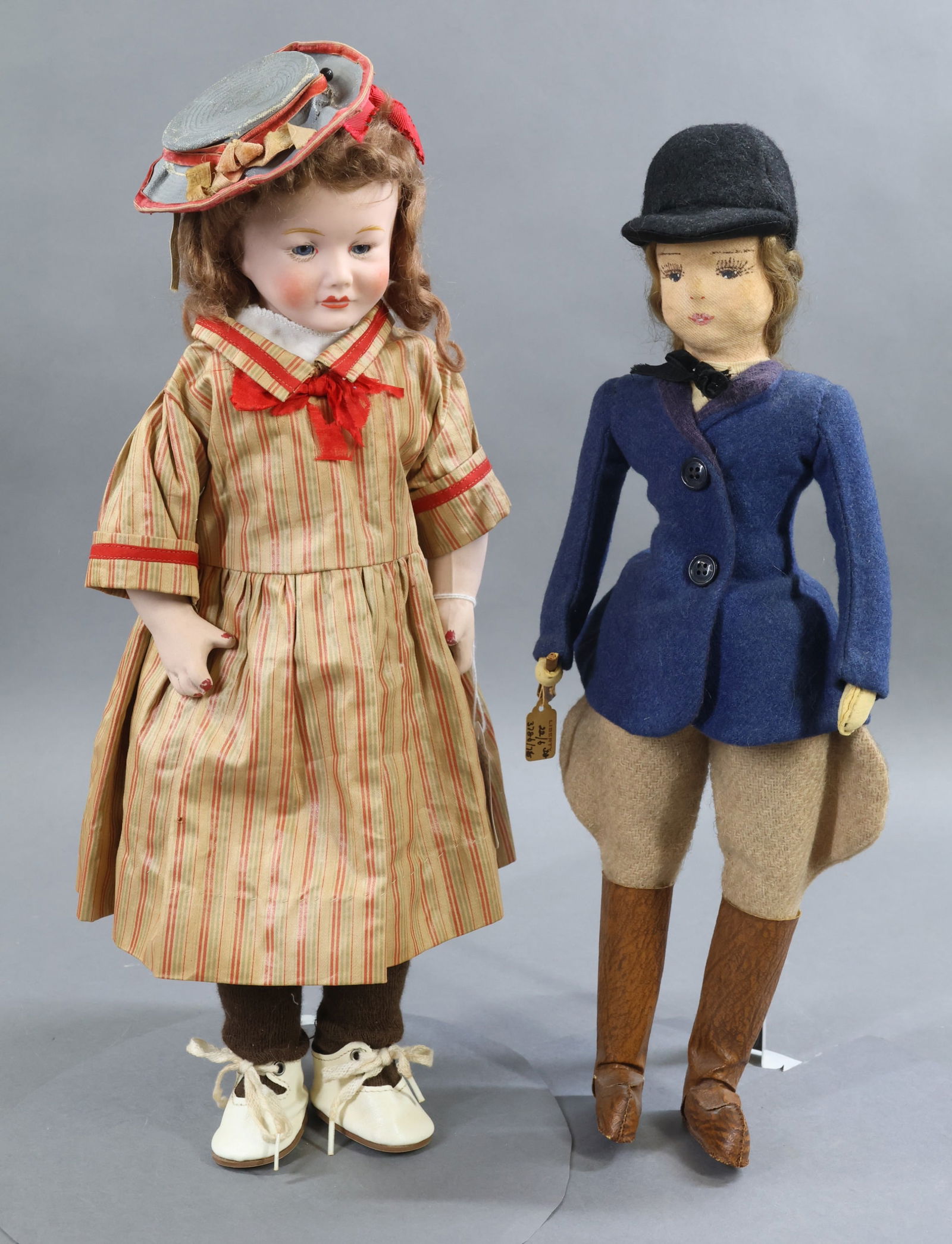 ENGLISH DOLLS.: Pair of female child dolls. Doll 1) 18" NTI GIRL ENGLISH MAKE (Hancock) Bisque shoulder head doll c. late 1920's? Stationary blue eyes, open/closed mouth, brown mohair wig. Oilcloth body with bisque