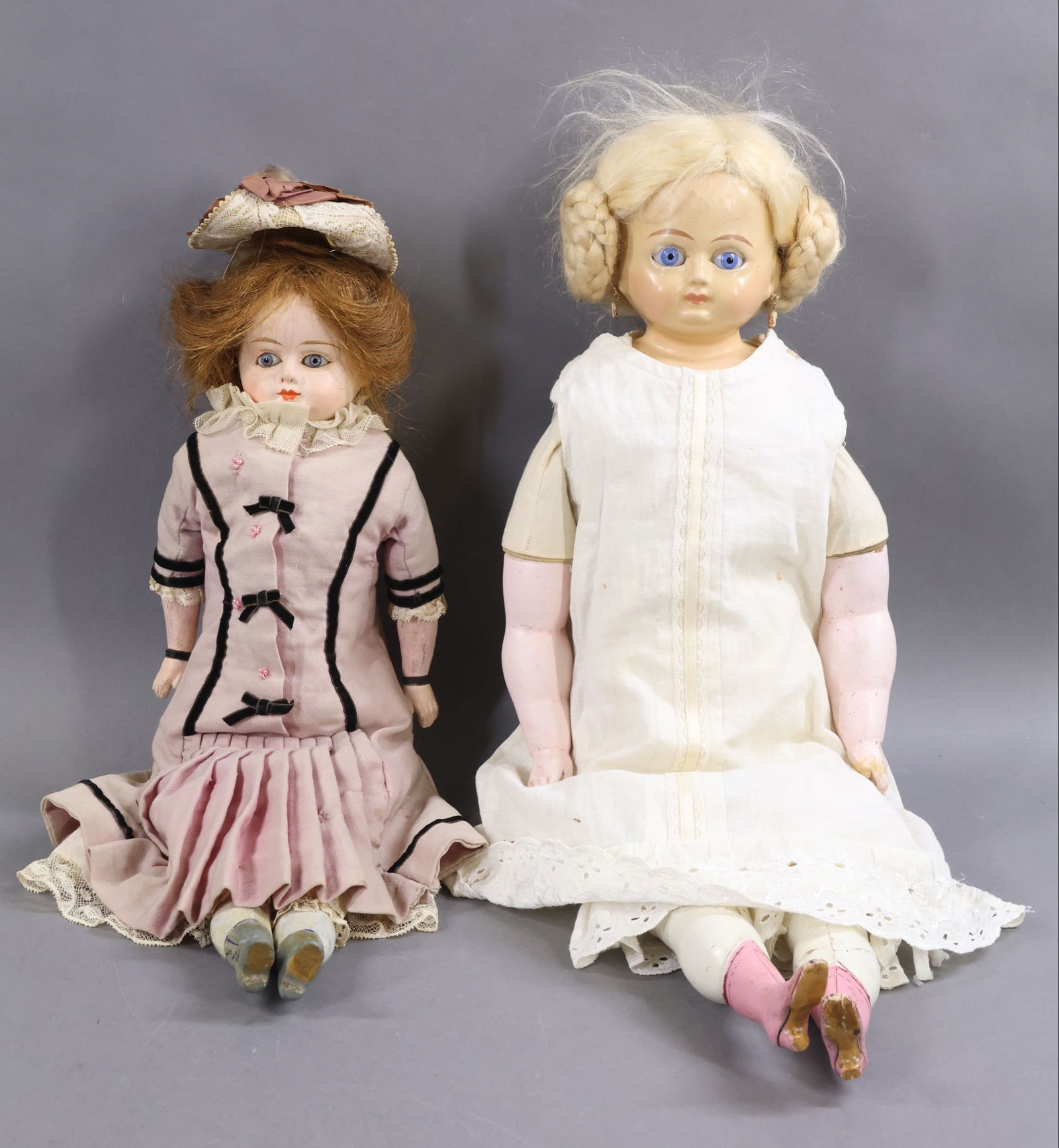 PAPIER MACHE/WAX OVER DOLLS.: Pair of dolls. Papier mache - 20" PATENT WASHABLE with stationary blue eyes, brown HH wig. Cloth body with papier mache lower arms and legs with painted grey heeled boots. Dressed in antique pink