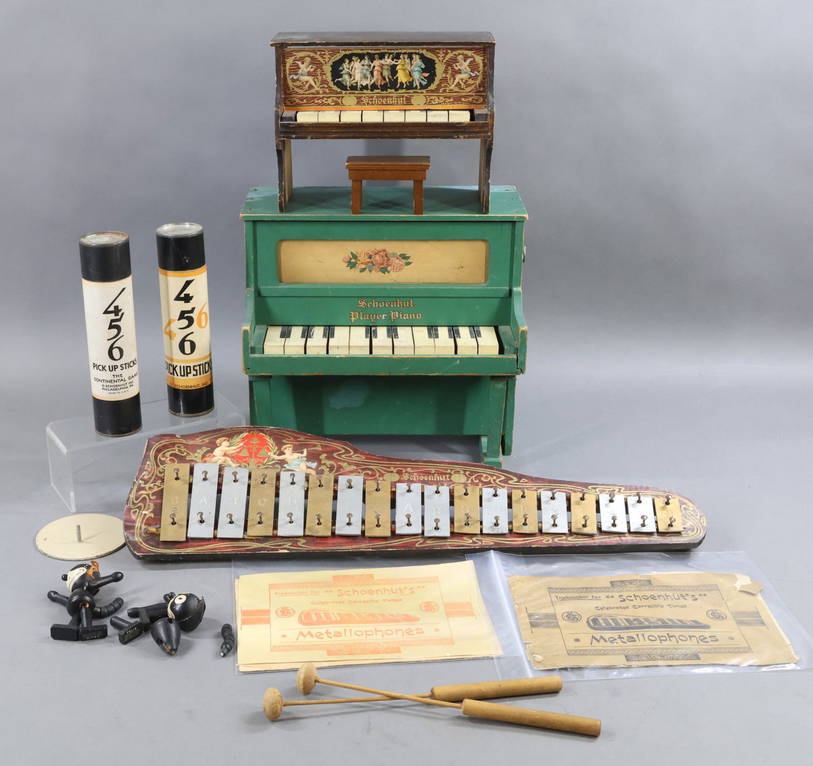 SCHOENHUT.: LOT of musical instruments and non-doll items. Musical Instruments - 23" "Metallophone" with (2) "Instructor" booklets. (2) Wooden Mallets. (Age loss on booklets.) Green wooden "Player Piano" with