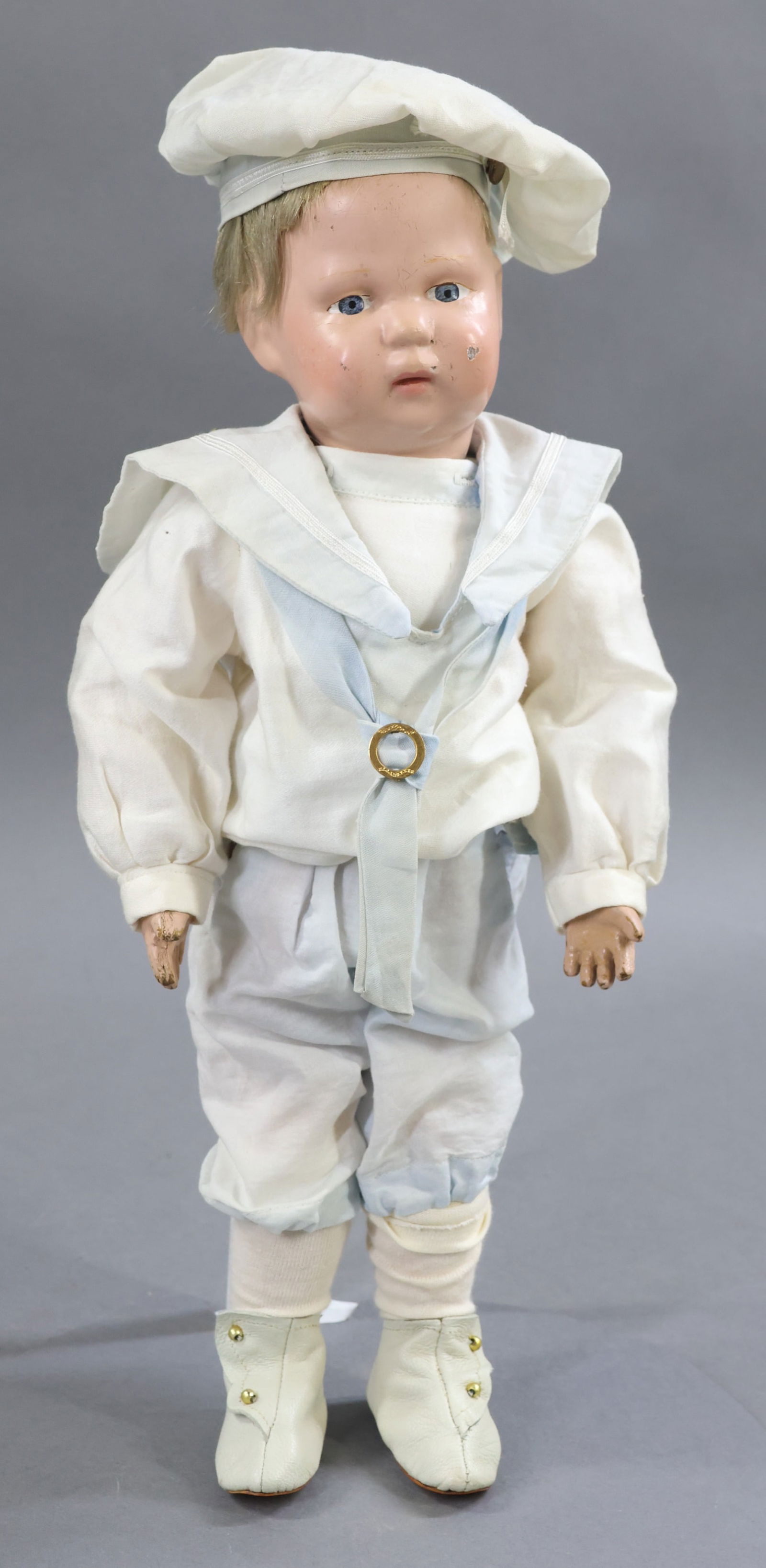 SCHOENHUT.: 14" Model No. 107, 1913-1926. Painted blue eyes. Factory original tosca mohair wig. Incised mark on back of torso. No original clothing, he is dressed in antique 3 pc. sailor style suit - middy