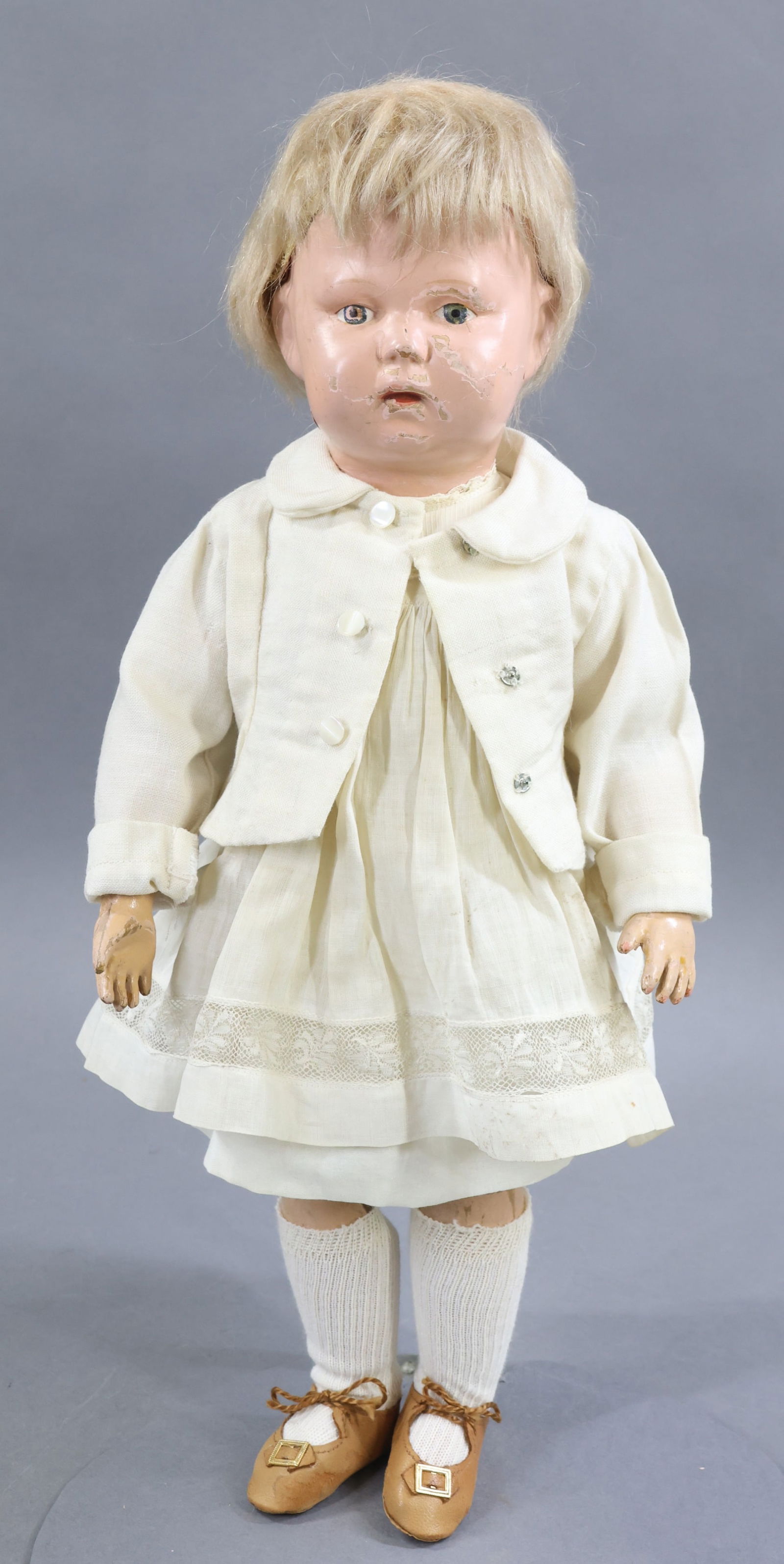 SCHOENHUT.: 17" Model No. 108 Toddler, 1913-1926. Painted blue eyes. Replaced antique blonde mohair wig. Round incised mark on back of head. Incised mark on back of torso. No original clothing, dressed in