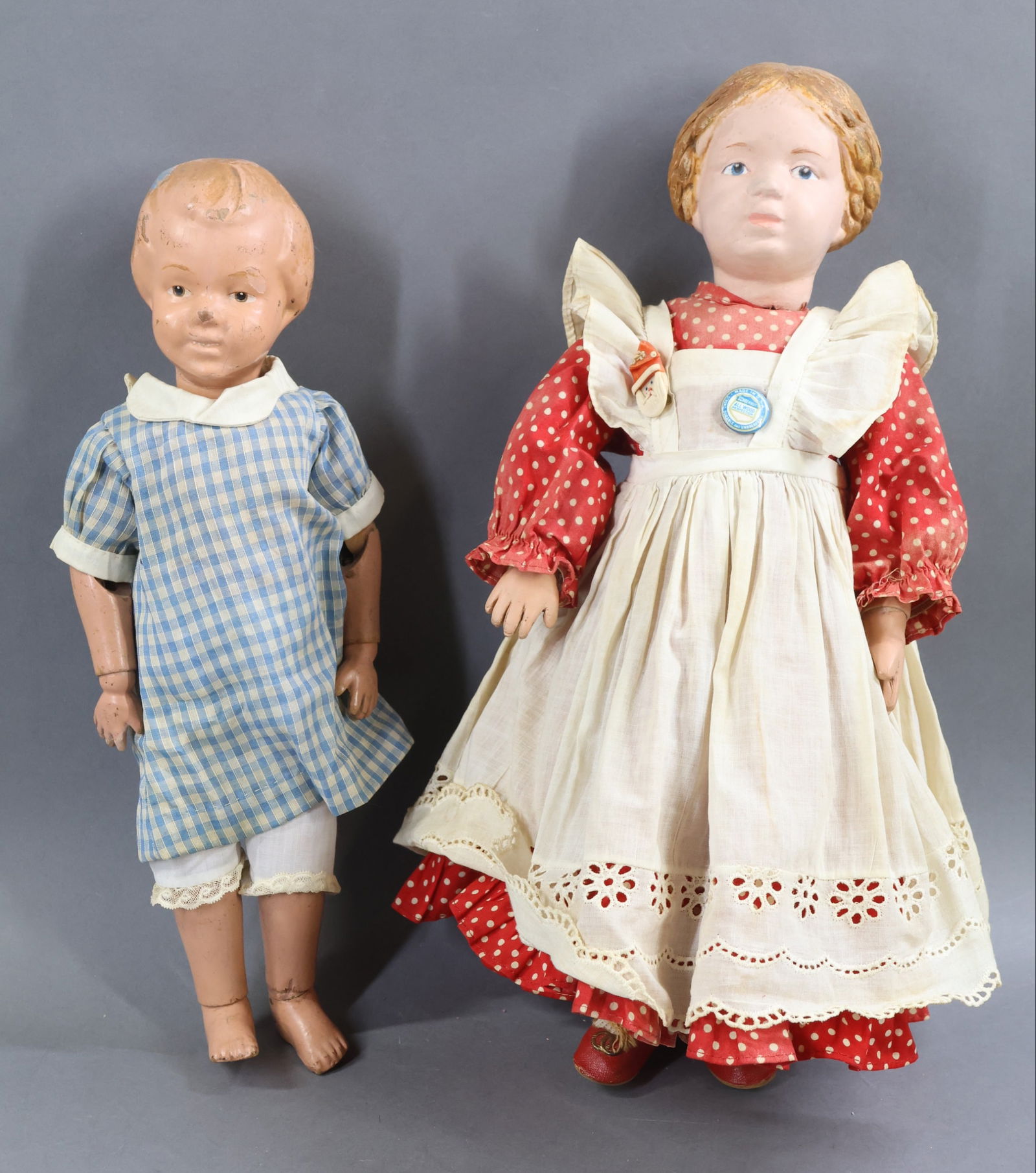 SCHOENHUT.: Pair of carved head dolls. Doll 1) 14" Model No. 101, April 1912-1923 (Note: Carol Corson's book "Schoenhut Dolls" states that it was reissued in 1930 as a blonde. This doll may be of that date.)