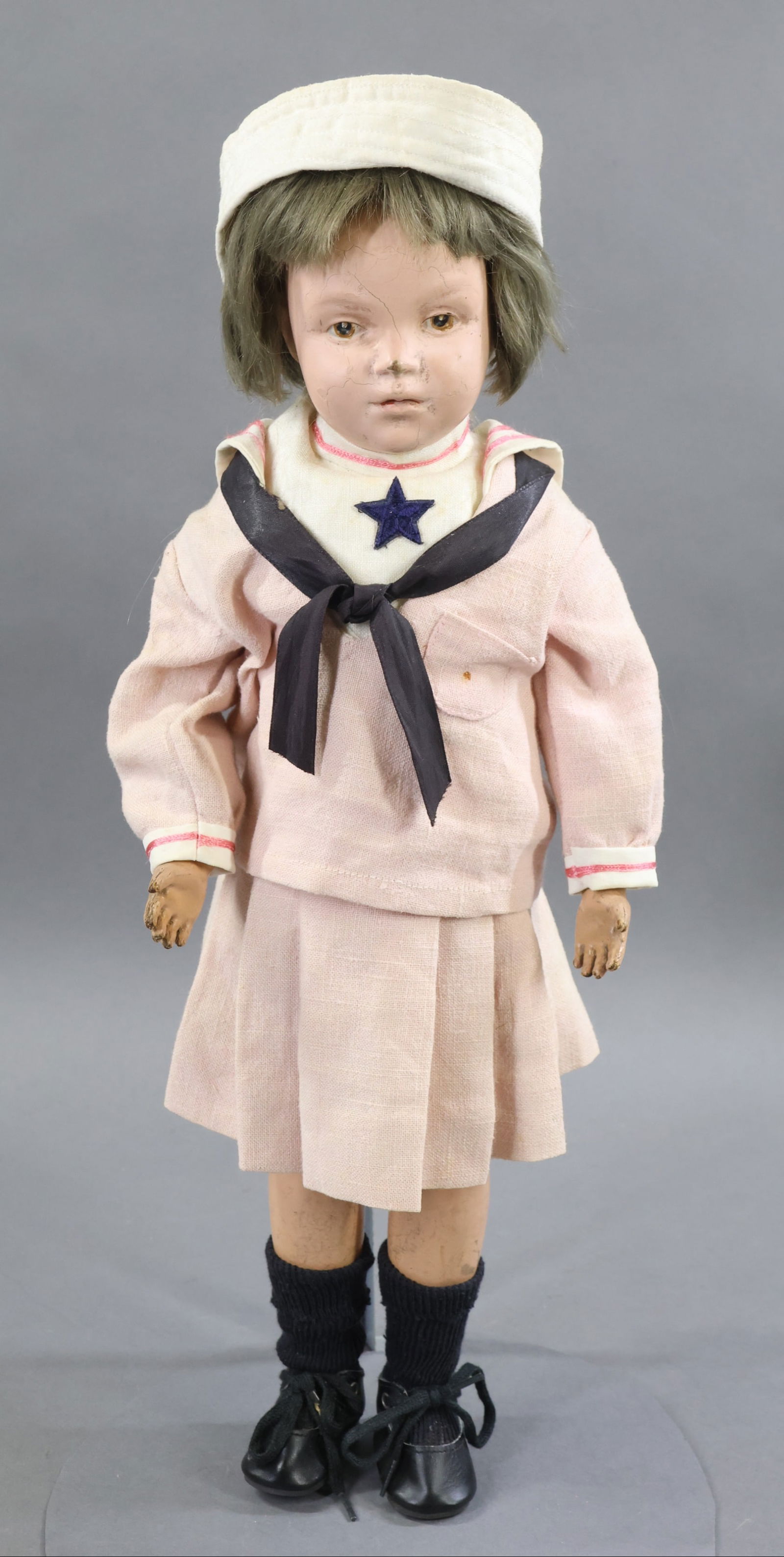 SCHOENHUT.: 19" Model No. 308, 1917-1924. Brown intaglio eyes, dark tosca mohair wig appears to be original. Incised mark on back of torso. No original clothing, dressed in vintage pink cotton copy of Schoenhut