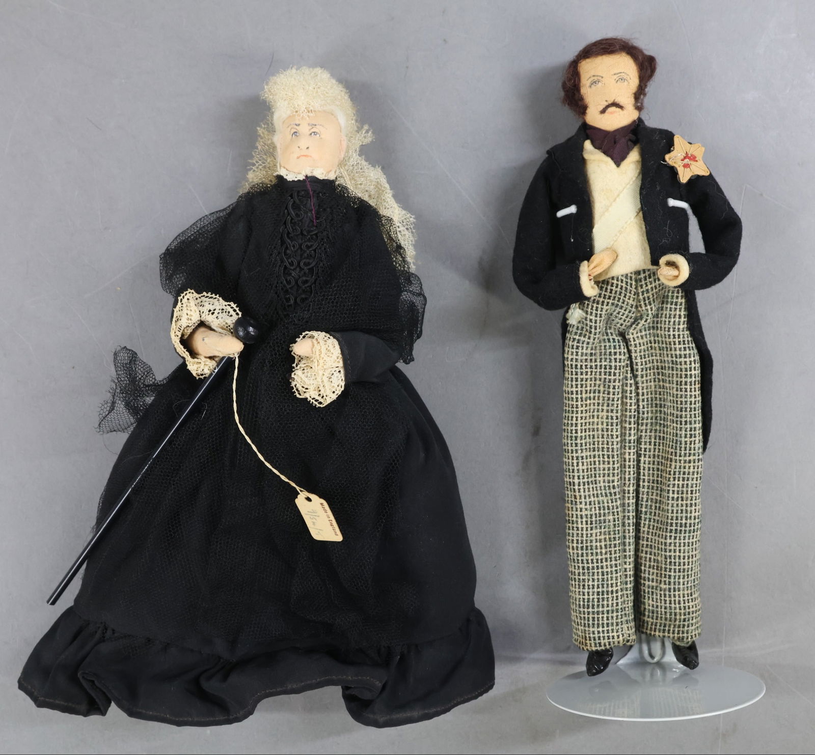 LIBERTY OF LONDON.: Pair of tagged dolls. "Queen Victoria" and "Prince Albert". (2) Stands. Condition: age discoloration. This lot is being sold AS IS.