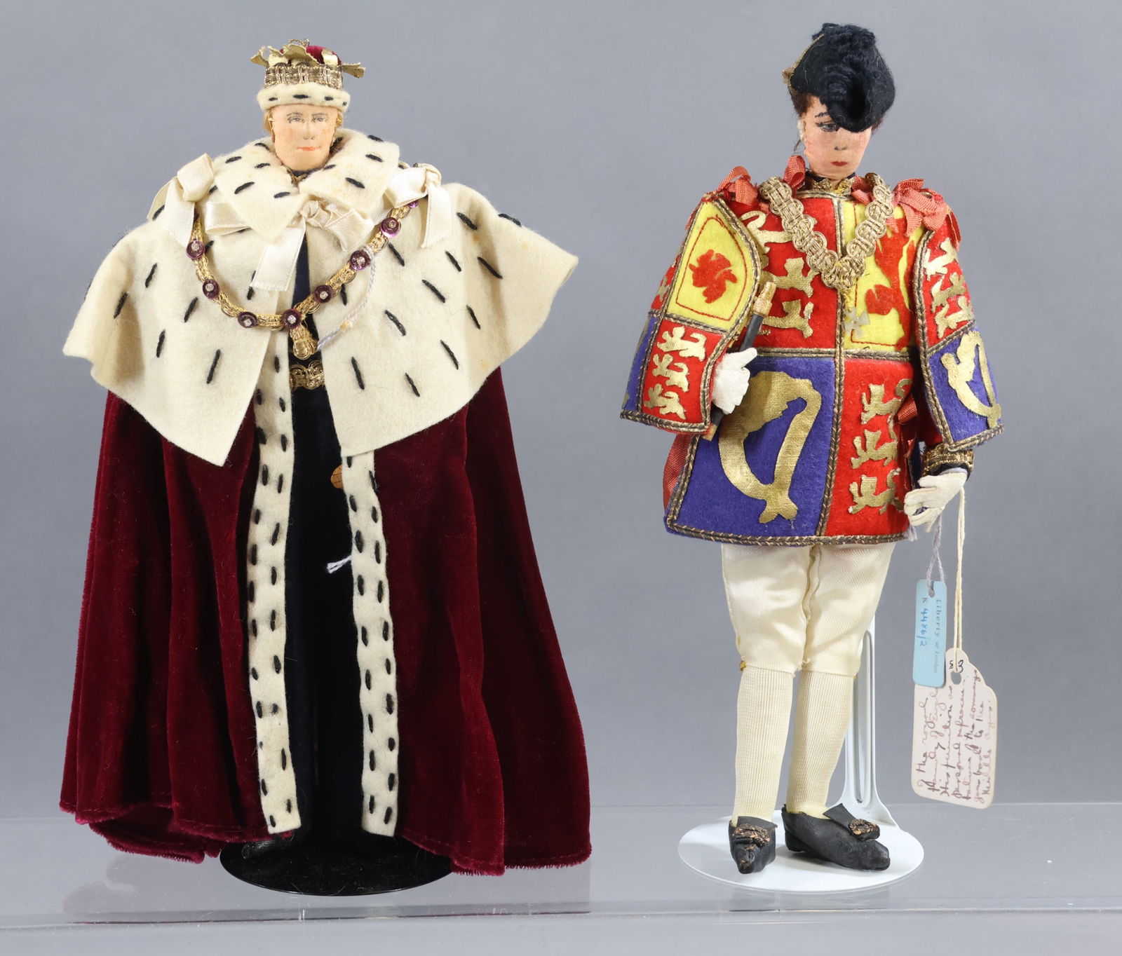 LIBERTY OF LONDON.: Pair of tagged male dolls. Both of these dolls have the blue hang tags and cloth tags. "Herald of The Royal College" He is wearing a tabard of the royal family of England and holding the Wand of Offic