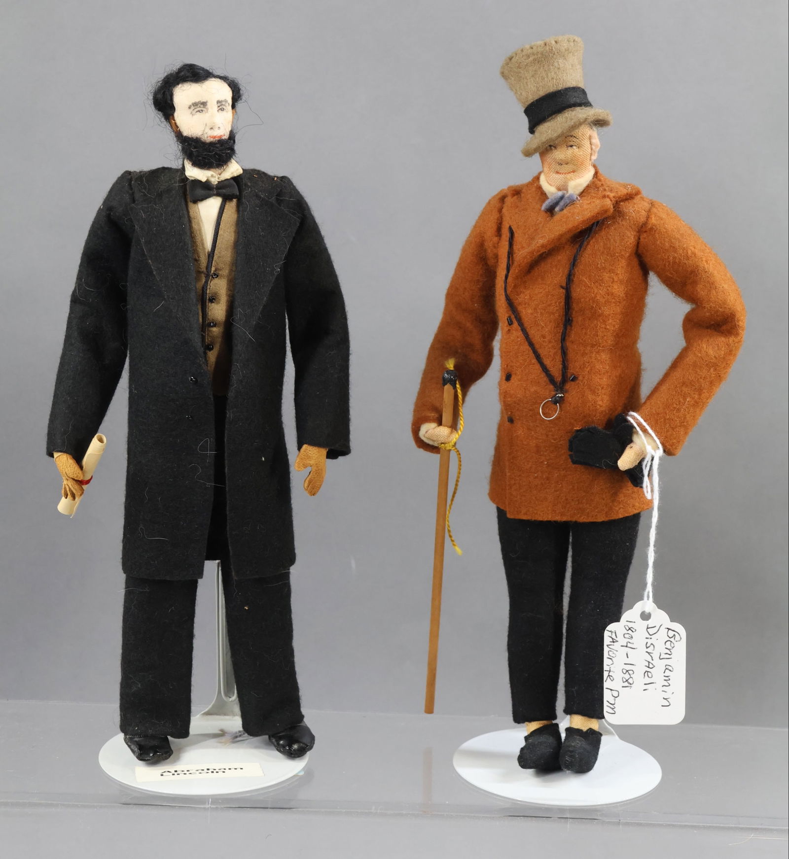LIBERTY OF LONDON.: Pair of tagged male dolls. "Abraham Lincoln", blue hang tag and cloth tag. "Benjamin Disraeli", 1804-1881, Favorite Prime Minister of Queen Victoria. He was the 1st Earl of Beaconfield. Condition: min