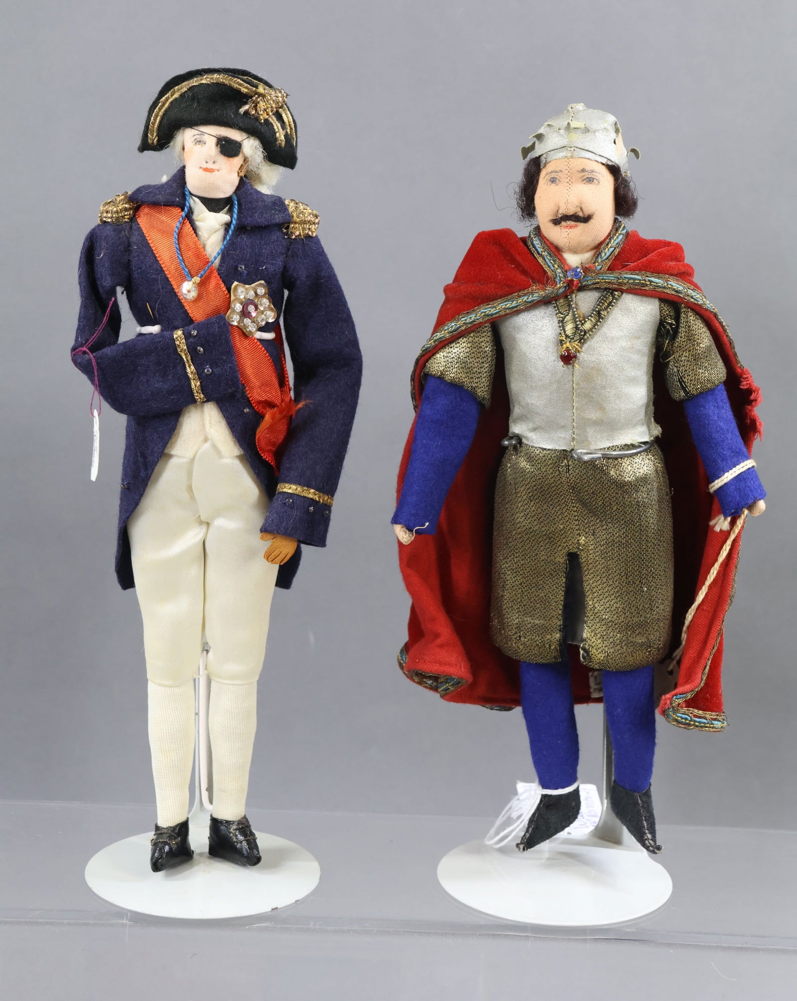 LIBERTY OF LONDON.: Pair of tagged male dolls. "William I" of Normandy also known as "William the Conqueror", 1066-1087. Center seam. "Lord Nelson". (2) Stands. Condition: nothing observed. This lot is being sold AS IS.