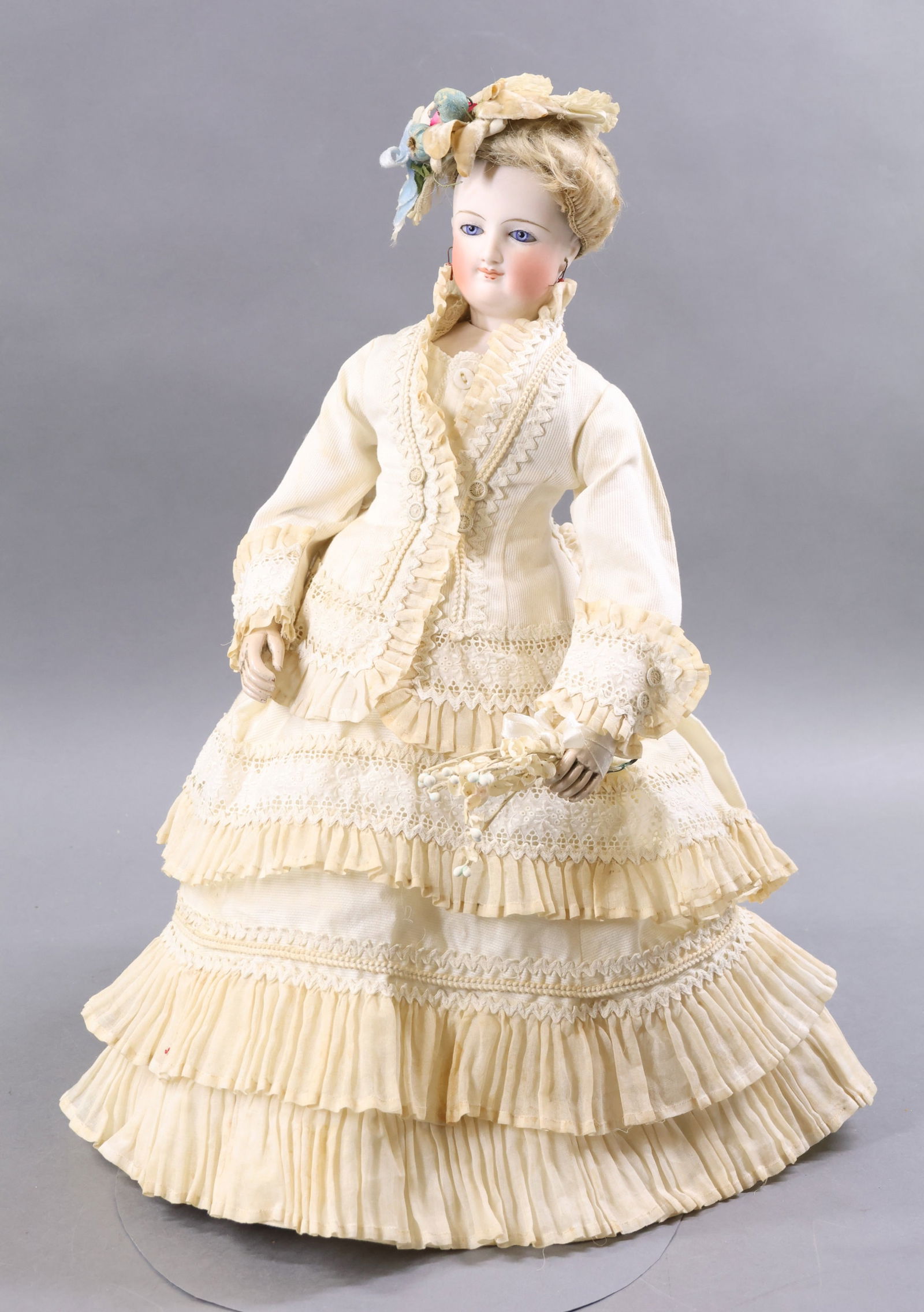 ANTIQUE FRENCH BISQUE HEAD DOLL.: 18" "G" French Fashion Doll. Blue paperweight eyes, closed mouth, pierced ears, antique blonde mohair wig, cork pate. Bisque socket head on a bisque shoulder plate marked "H" on shoulder. Jointed wood