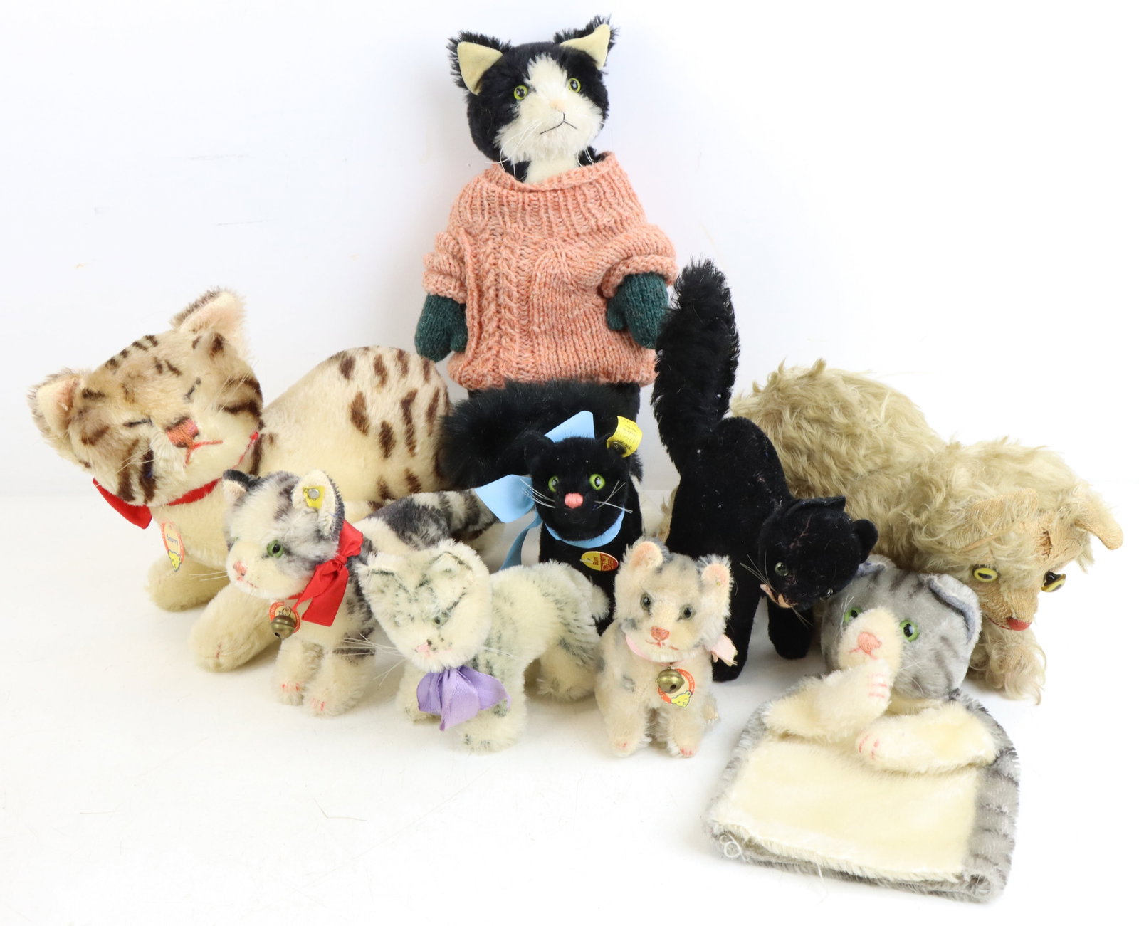 Steiff and Other Mohair Cats: (6) Mohair cats including hand puppet. (5) "Susi", (2) Black "Tom" cats with arched backs, (1) is plush "Burri", not all are marked. also vintage white long mohair cat. Artist cat - black and white