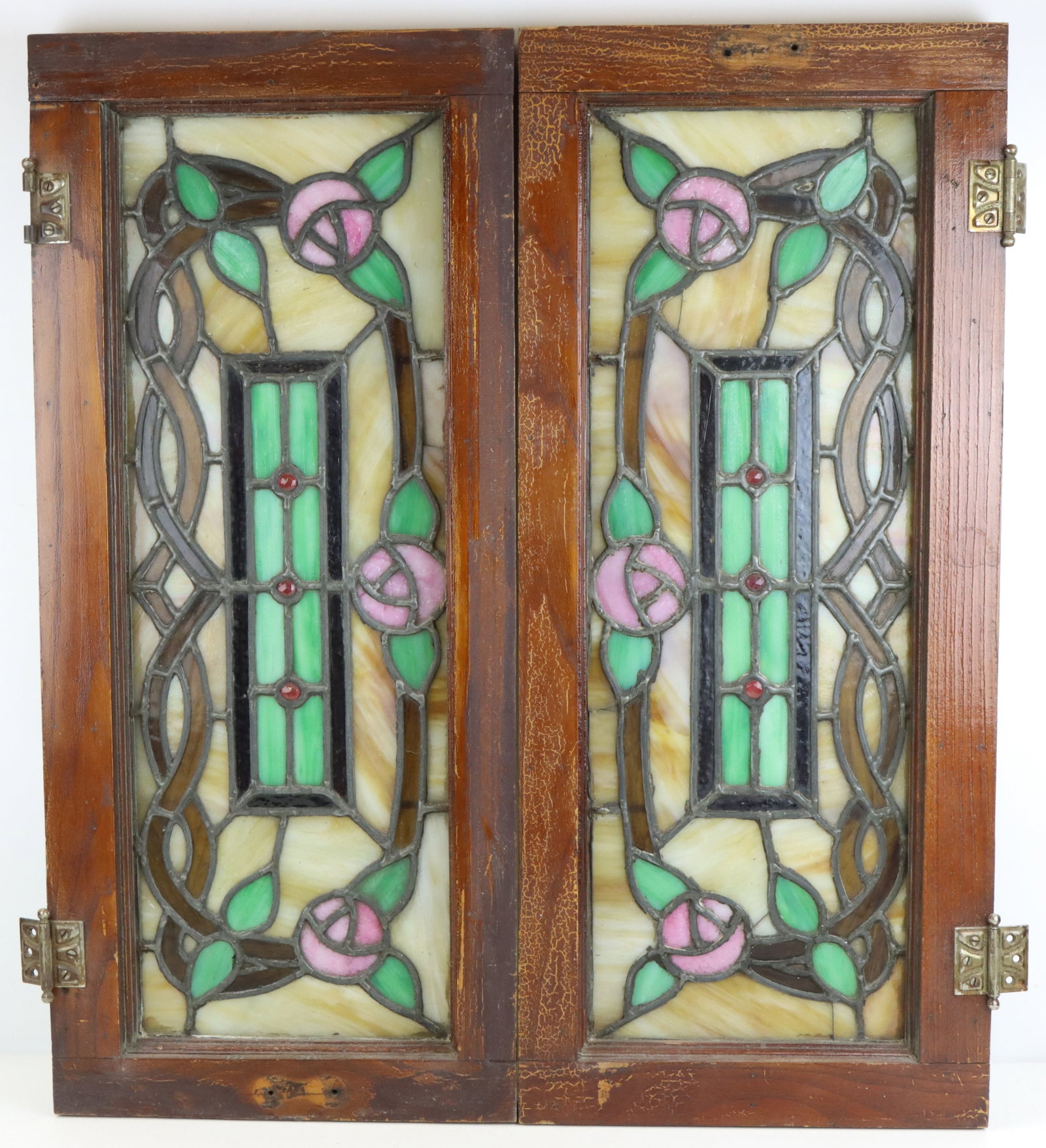 Transom Window Panels: Slag leaded glass transom window panels (2, each 32”h x 14”w x 1.75”d), wood frames, slight hairline cracks noted in images, antique hardware.