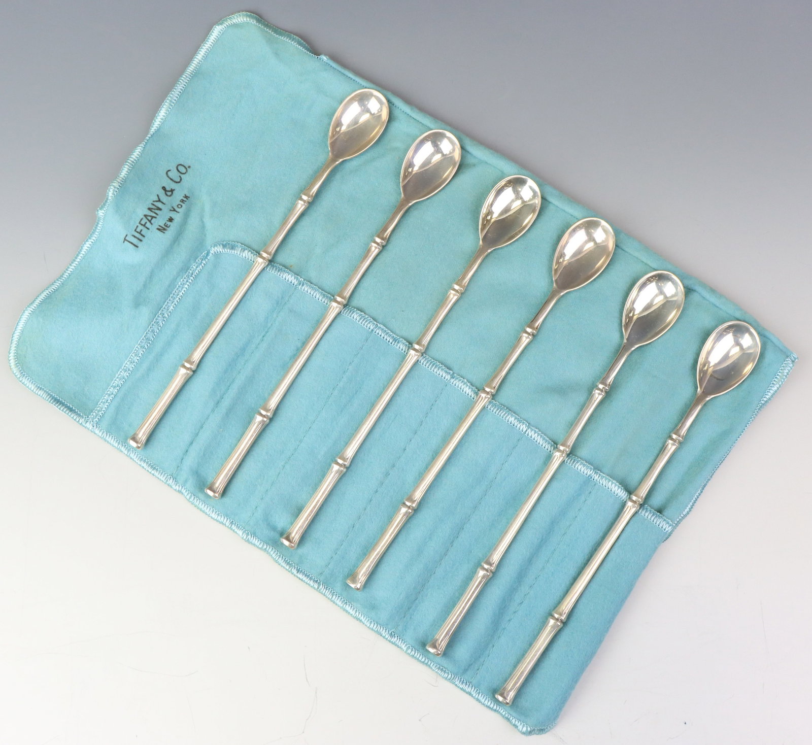 Tiffany "Bamboo" Sterling Silver Iced Teaspoons: American sterling silver iced teaspoons, including original storage cloth. A set of (6). 7.75”, and 8.55 ozt