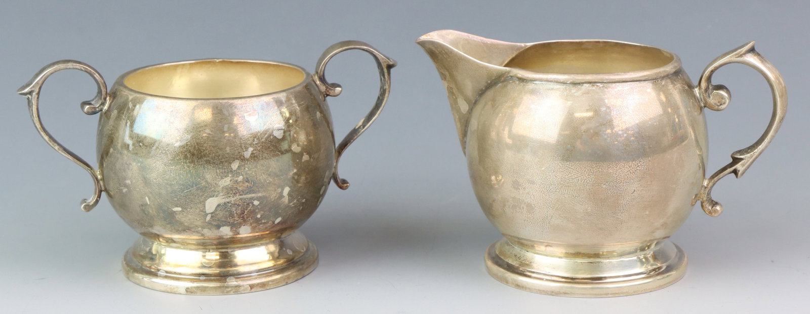 Welsch Sterling Silver Creamer and Sugar: Peru sterling silver creamer and sugar bowl set with a Mid-Century Modern design. (2) pieces. Each approx. 2.5”h x 3.75”w x 2.5”d. 5.21 ozt