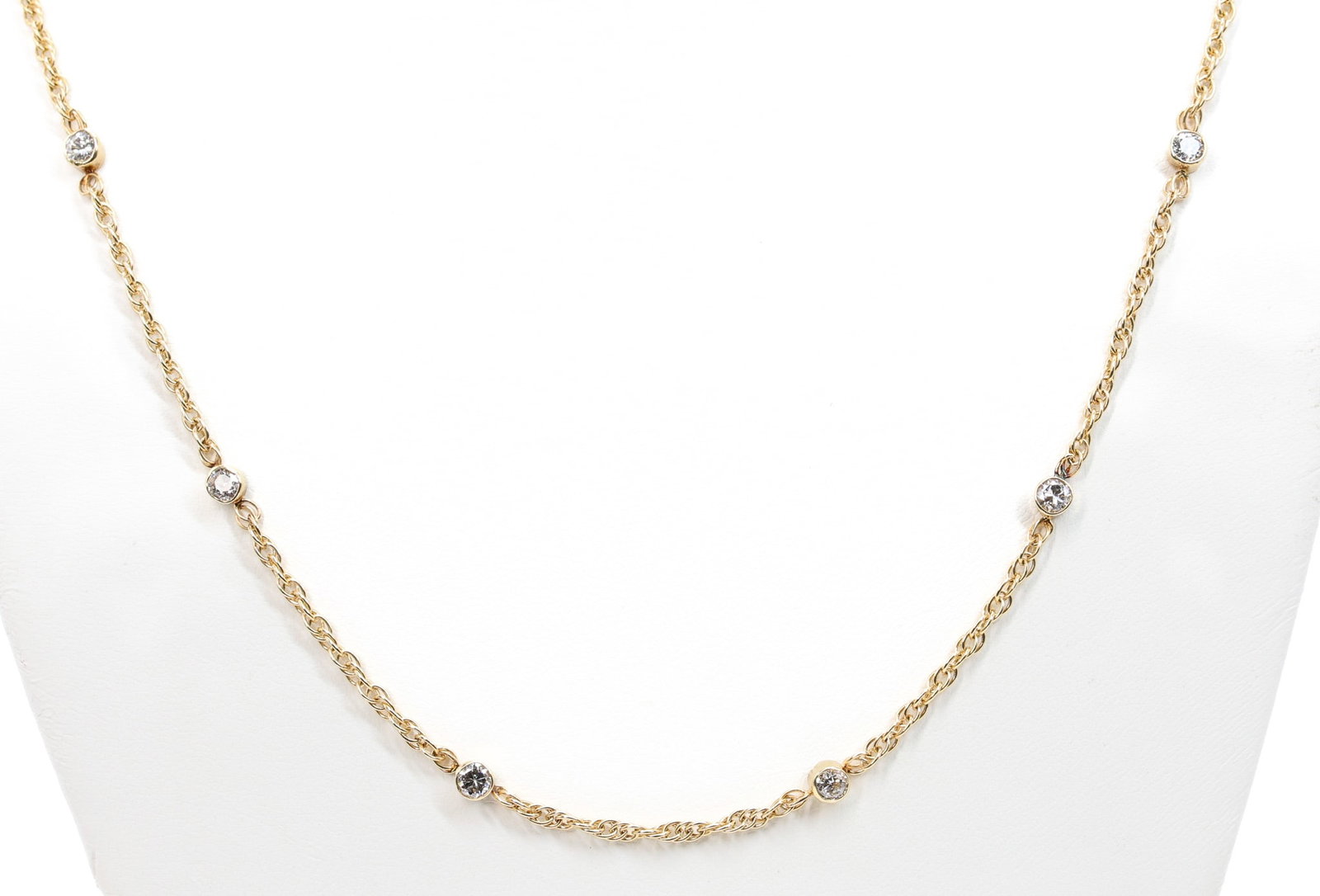 14k YG Diamond Necklace: 14k yellow gold station necklace set with round brilliant cut diamonds totaling approximately 2.4 carats. 32" and 6.2dwt.